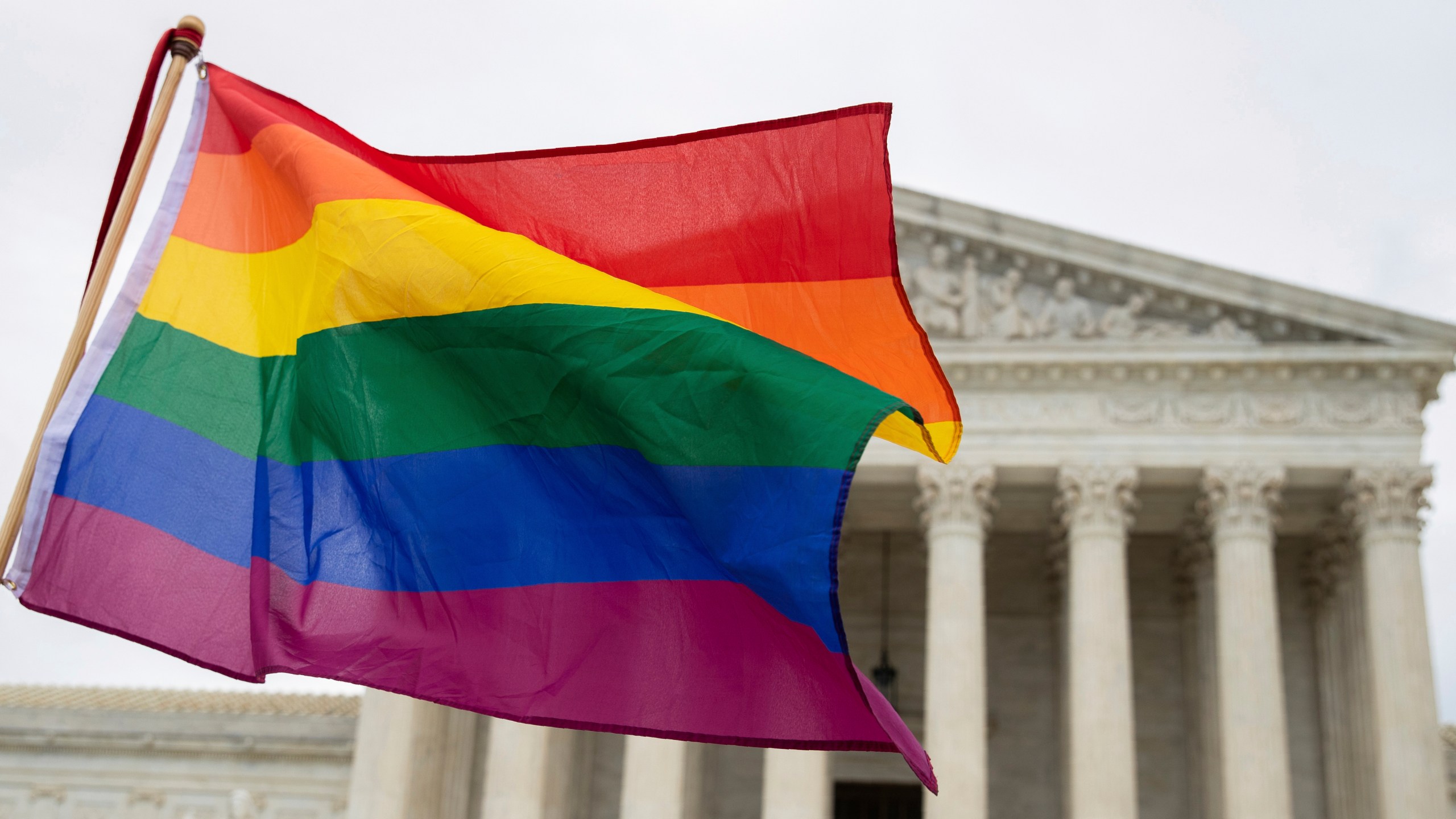 FILE - A pride flag is seen in front of the U.S. Supreme Court, Oct. 8, 2019, in Washington. (AP Photo/Manuel Balce Ceneta, File)