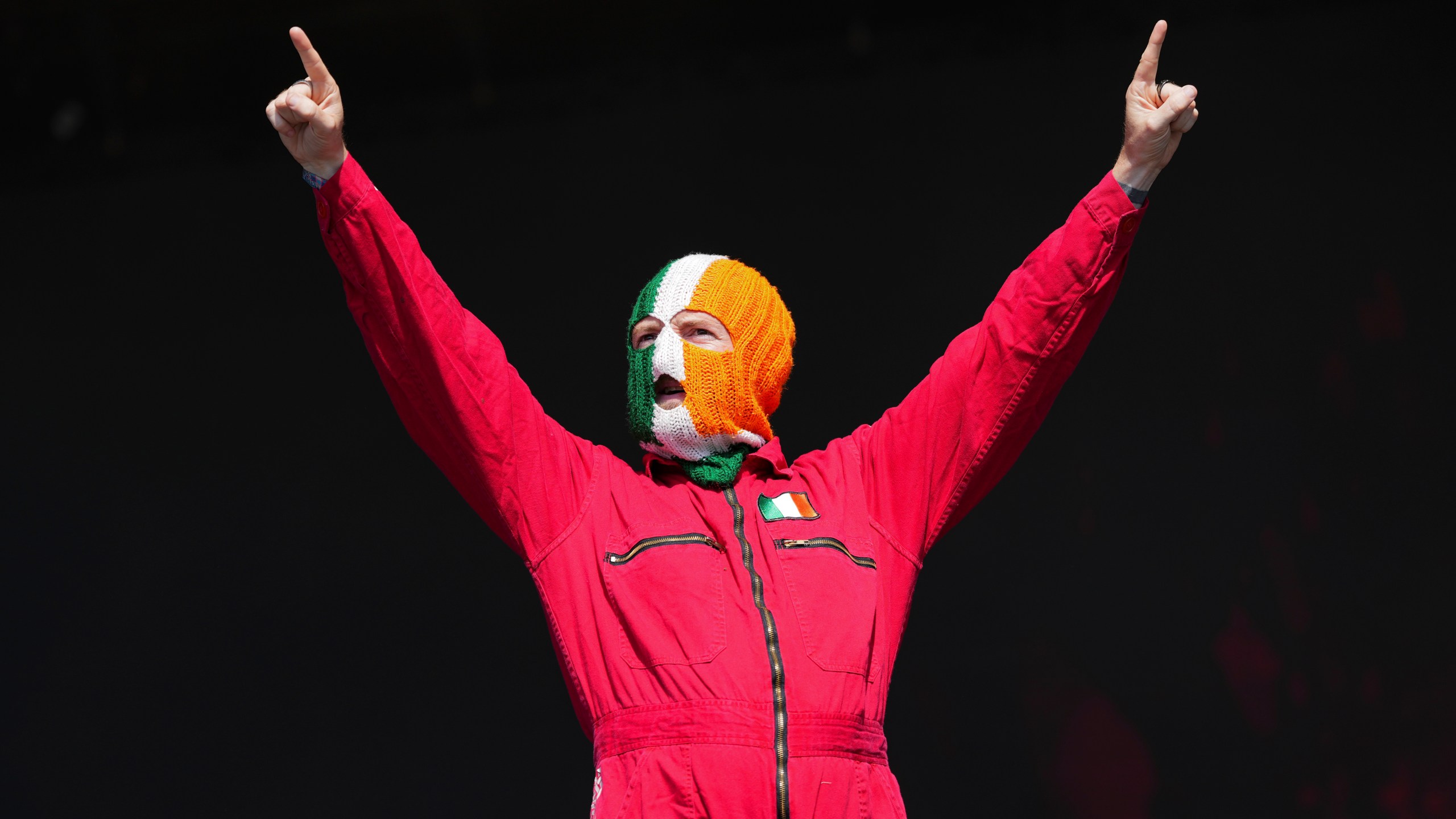 J. J. O Dochartaigh from the hip hop trio Kneecap performs during the Glastonbury Festival in Worthy Farm, Somerset, England, Saturday, June 28, 2025. (Scott A Garfitt/Invision/AP)