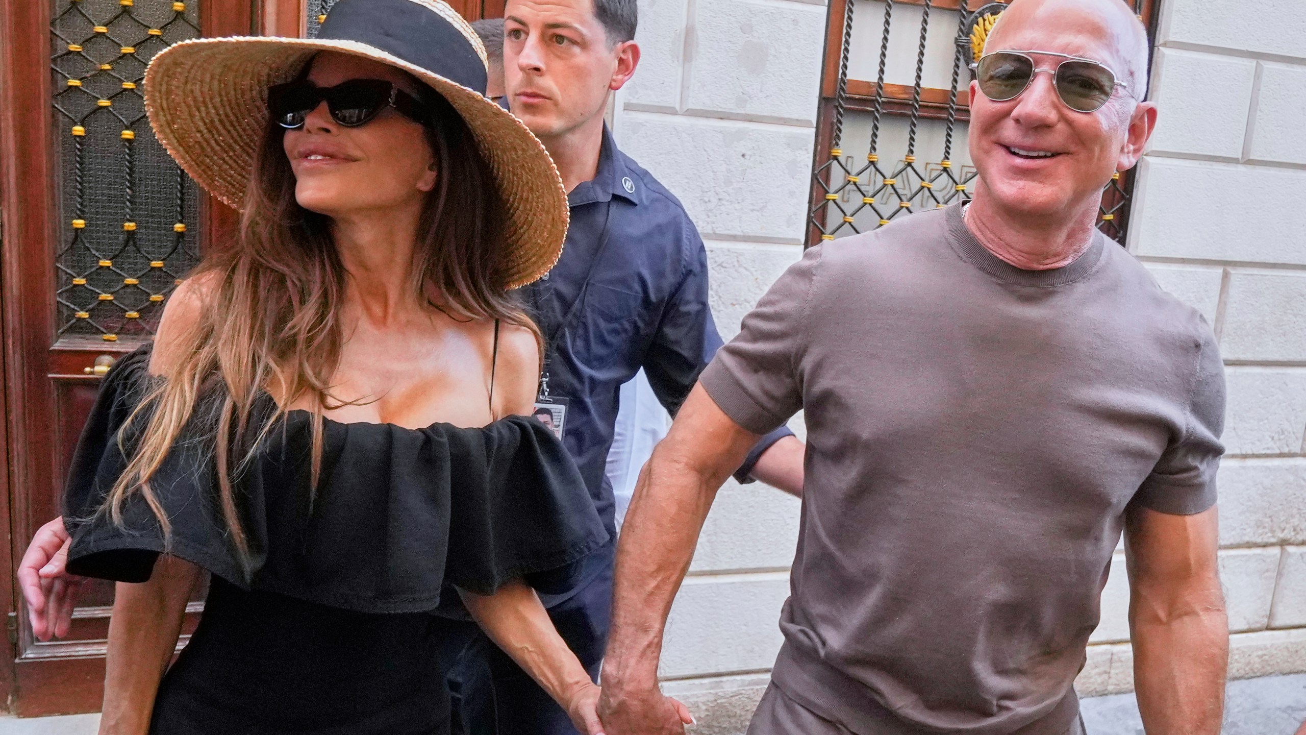 Lauren Sanchez Bezos and Jeff Bezos leave Harry's Bar in Venice, Italy, Saturday, June 28, 2025, the day after their wedding. (AP Photo/Luca Bruno)