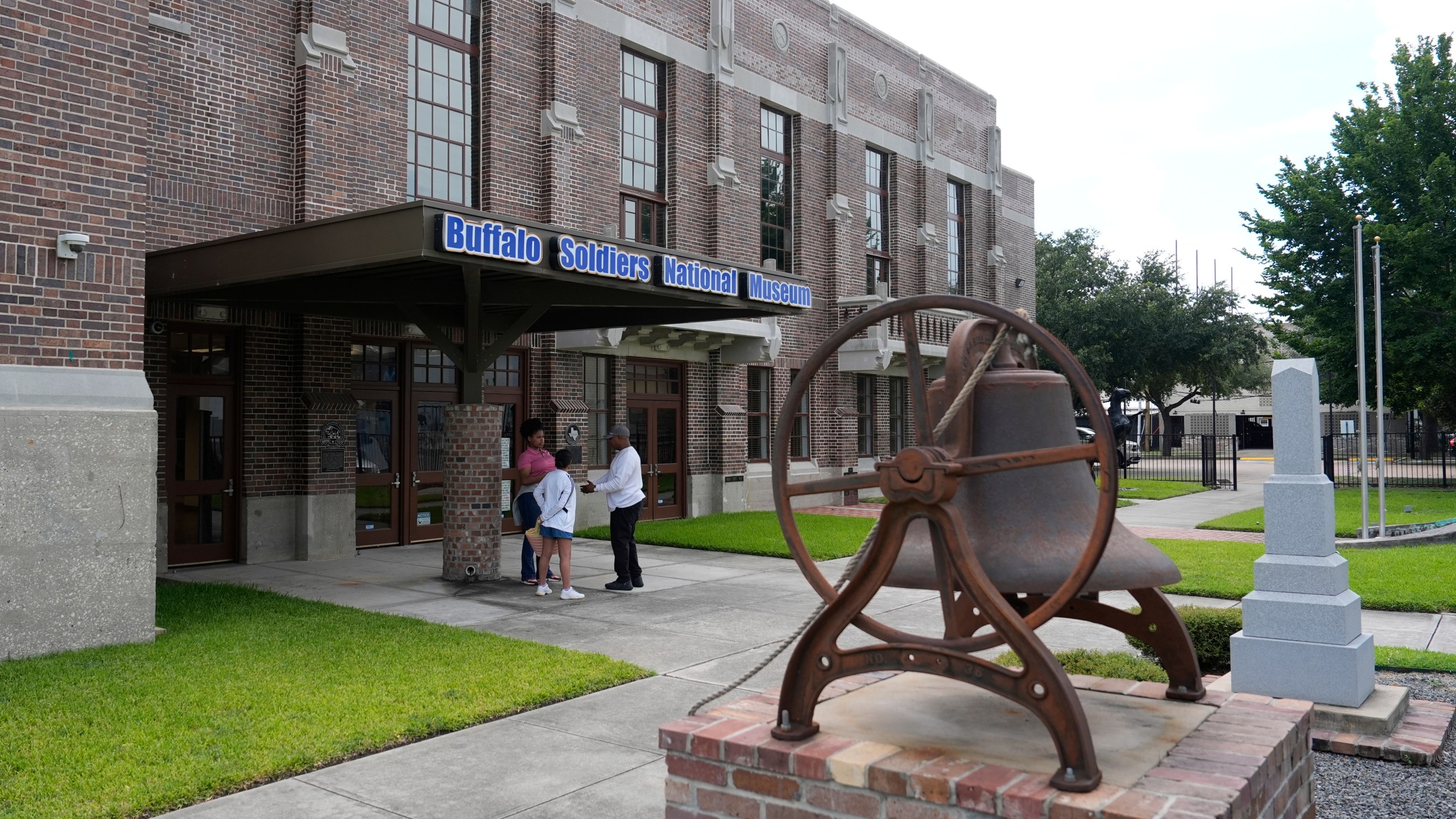 Patrons stand outside the Buffalo Soldiers National Museum on Friday, June 27, 2025, in Houston, Texas. (AP Photo/Ashley Landis)