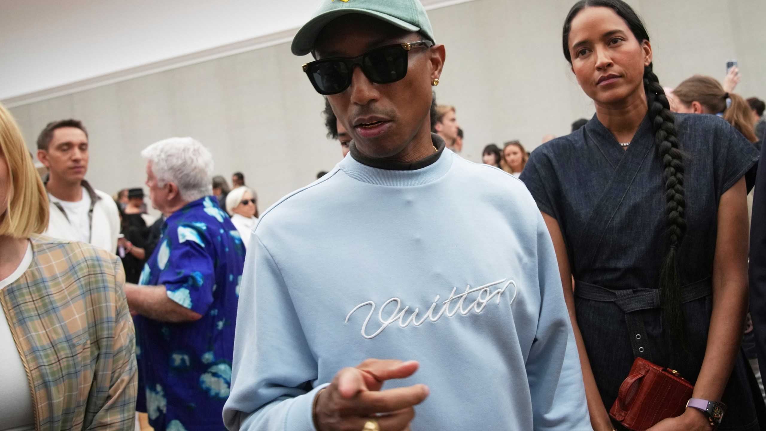 Pharrell Williams attends Dior Homme Spring-Summer 2026 collection, that was presented in Paris Friday, June 27, 2025. (AP Photo/Christophe Ena)