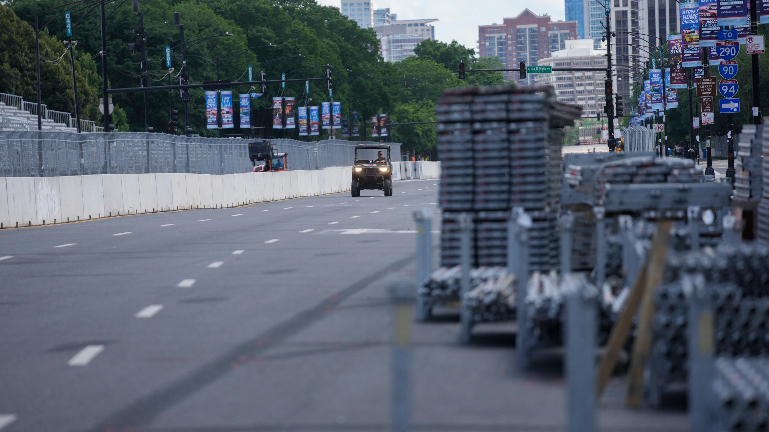 Construction of the street course continues ahead of the NASCAR auto racs, Friday, June 27, 2025, in downtown Chicago. (AP Photo/Erin Hooley)