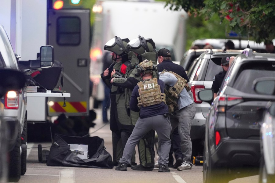 police work the scene after an attack in Colorado