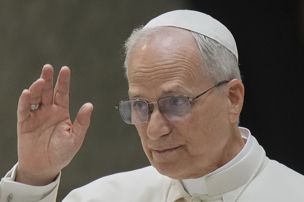 Pope Leo XIV waves to a crowd