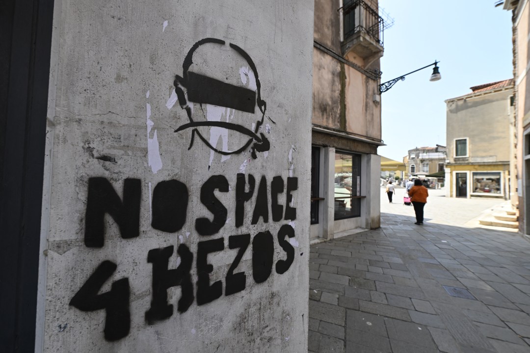 Graffiti that reads "No Space 4 Bezos"