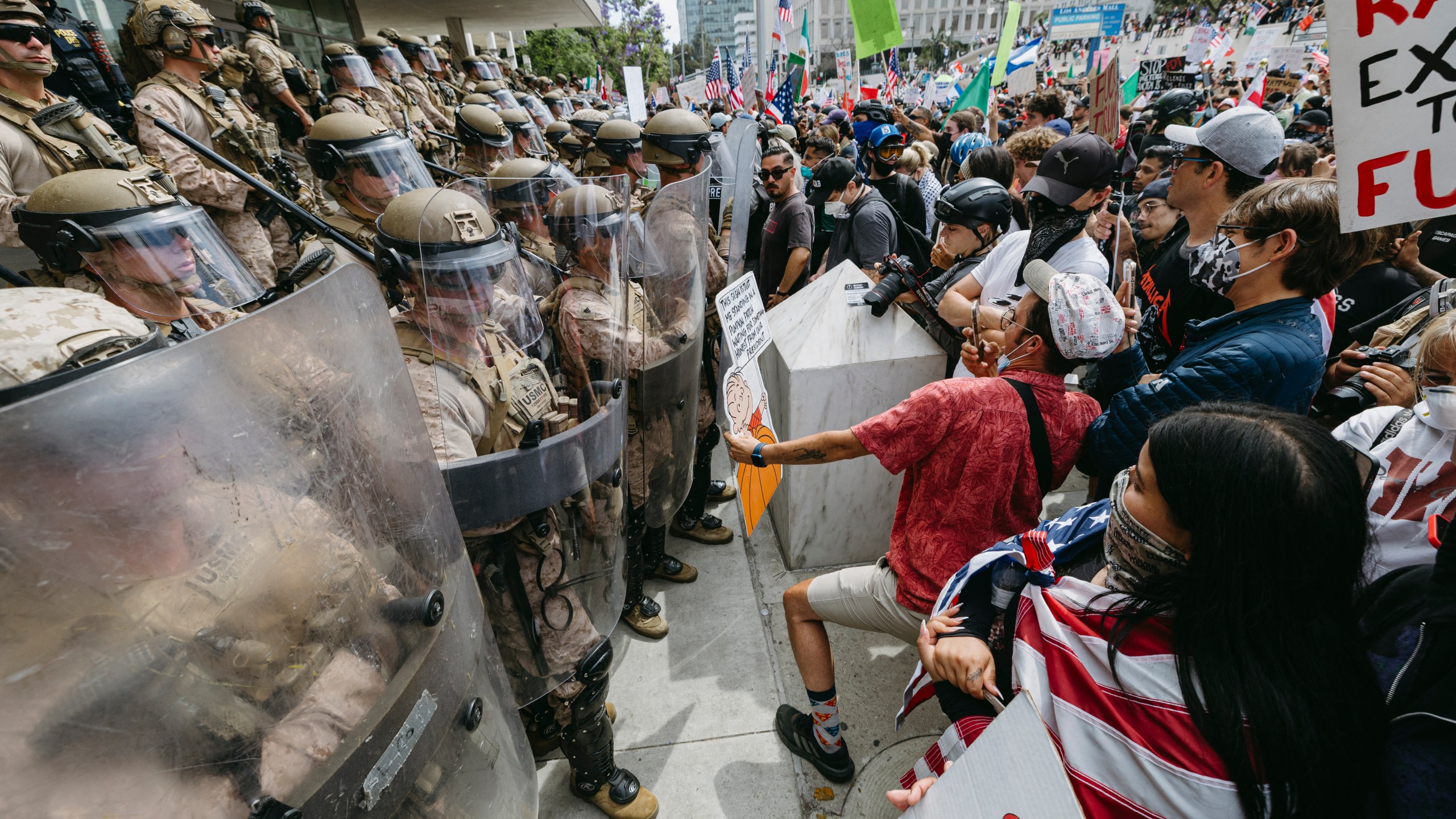 protesters and police clash in the street