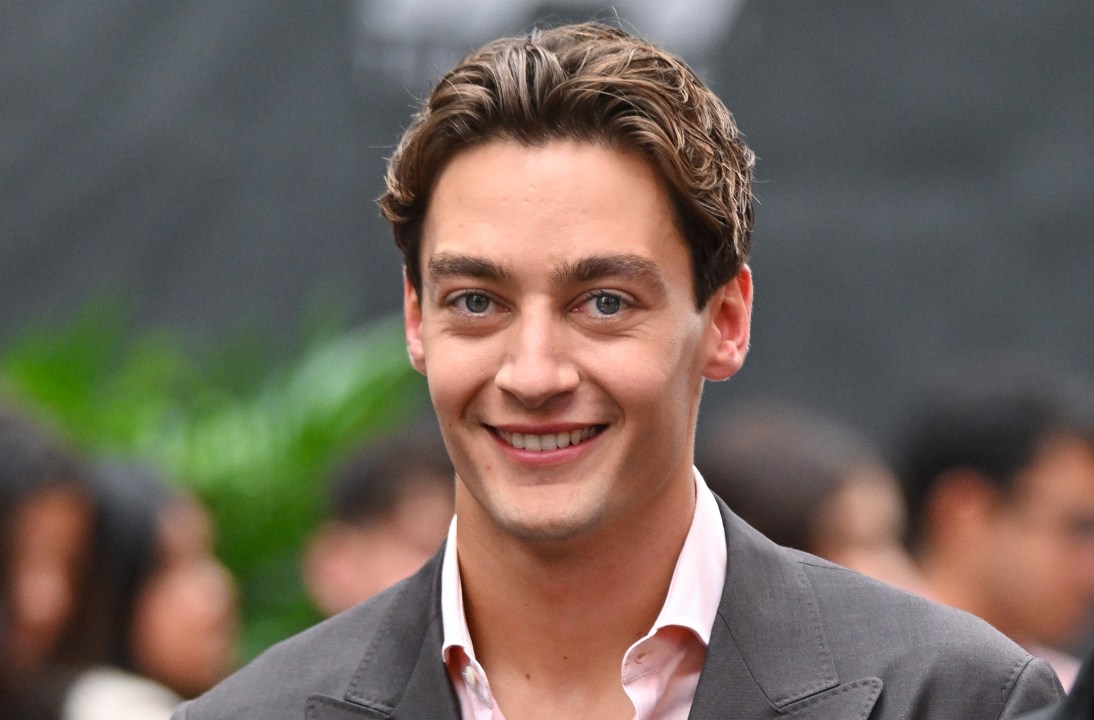 George Russell arrives at a movie premiere