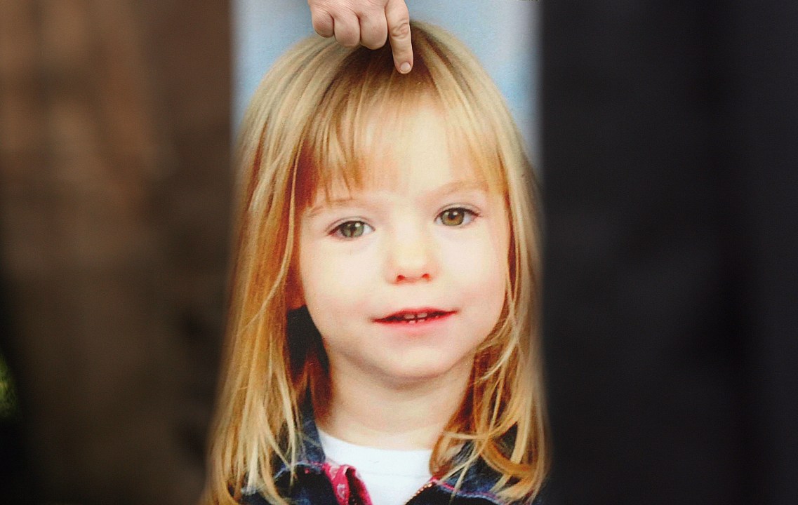 A picture of Madeleine McCann is held by her aunt 