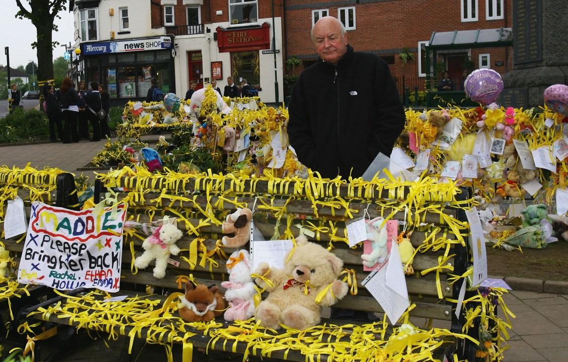 Brian Kennedy, the great uncle of missing child Madeleine McCann, stands amongst the messages of support at a memorial