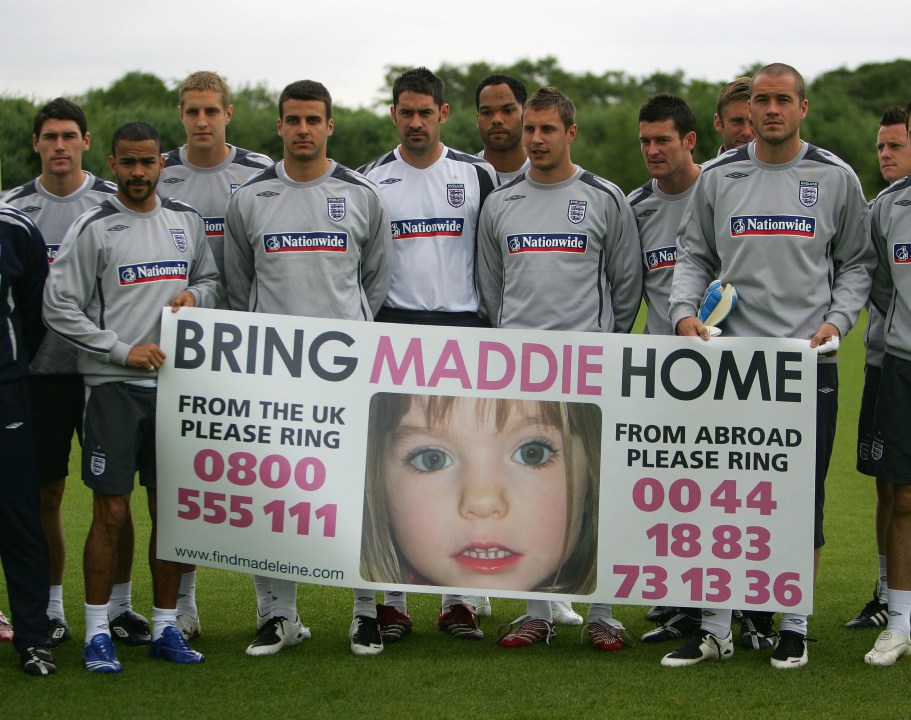 England players hold a banner calling for the safe return of Maddie McCann