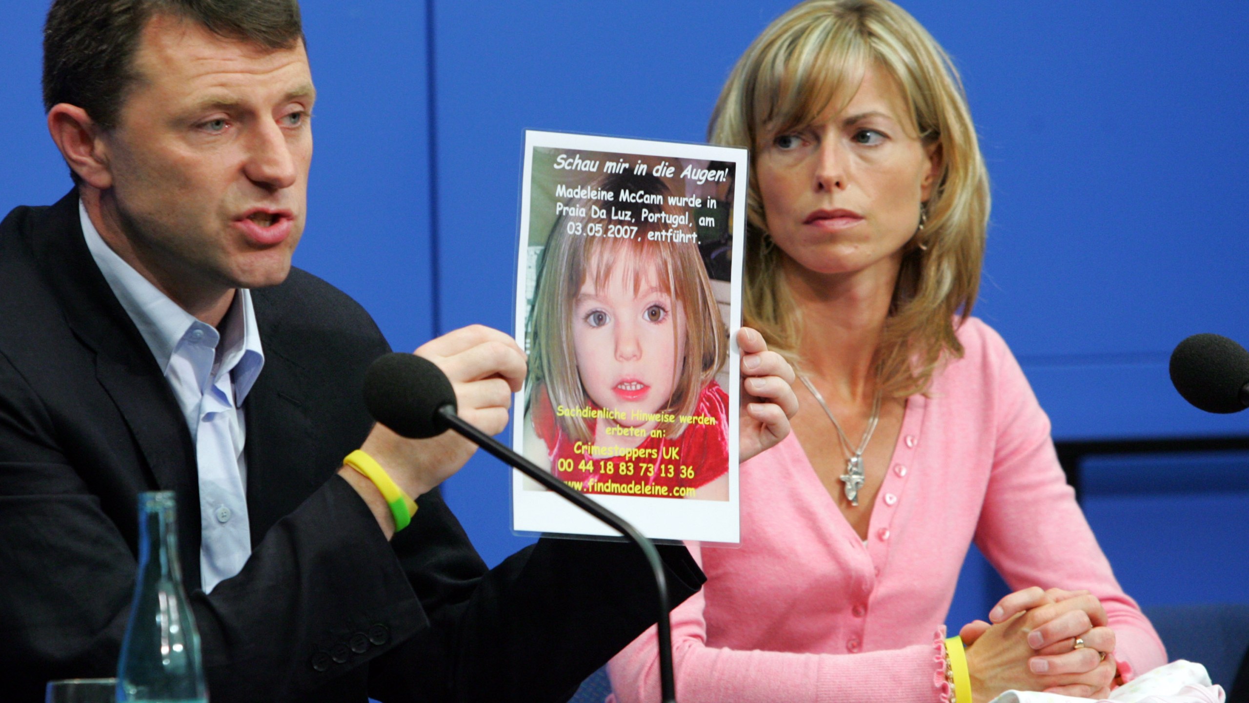 Kate and Gerry McCann display a poster of their missing daughter during a press conference