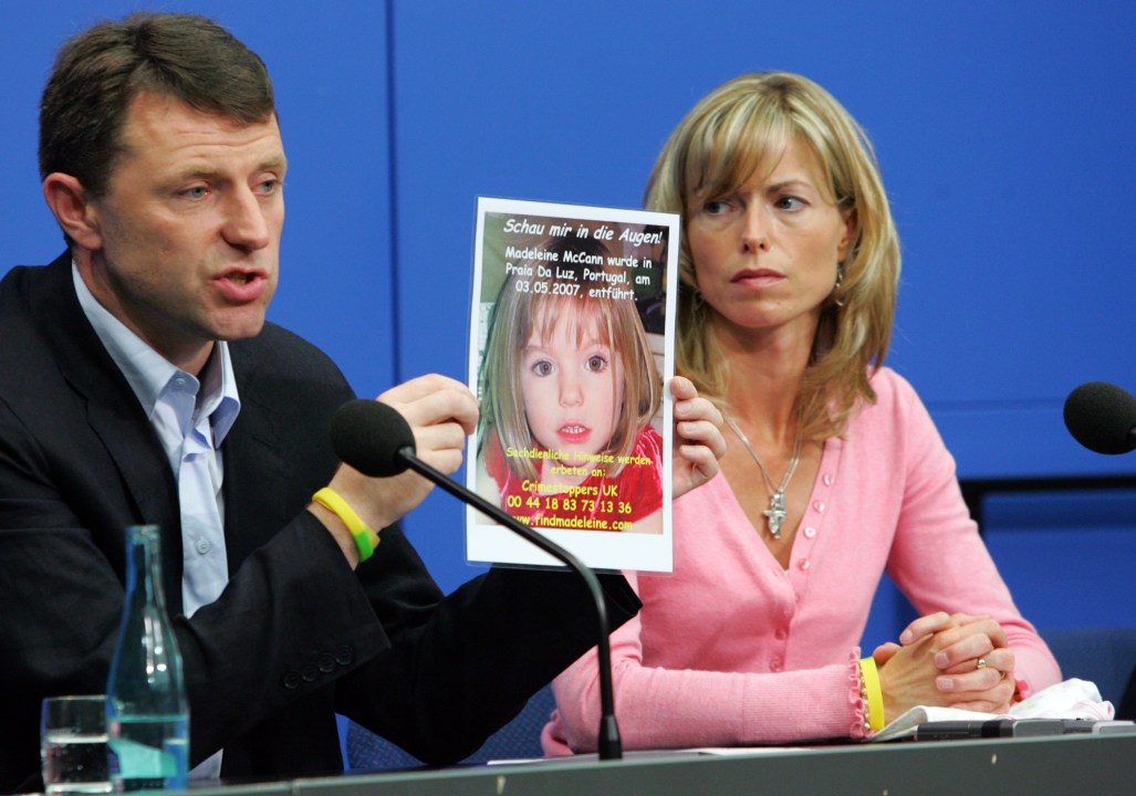 Kate and Gerry McCann display a poster of their missing daughter during a press conference