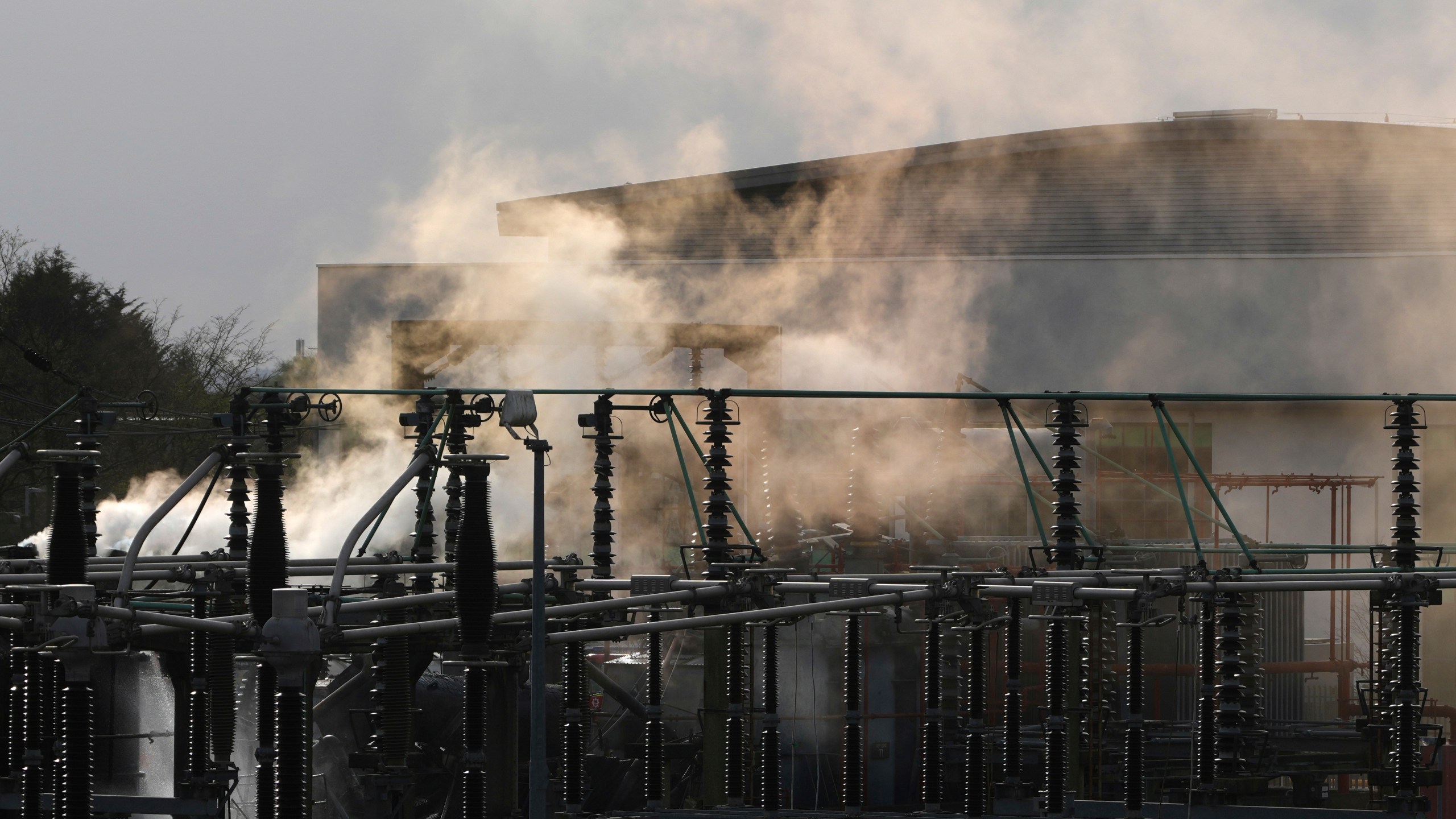 FILE -Smoke rises from the North Hyde electrical substation, which caught fire last night, leading to the closure of the Heathrow Airport, in London, March 21, 2025.(AP Photo/Kirsty Wigglesworth), File)