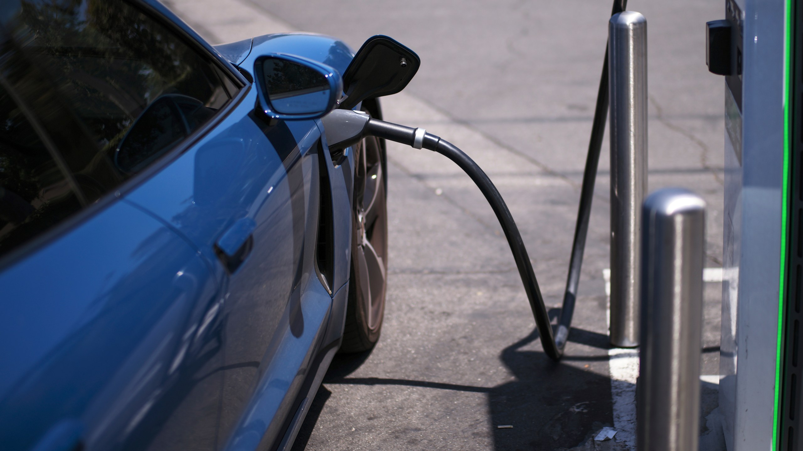 FILE - An electric vehicle charges at an Electrify America station in Arcadia, Calif., May 22, 2025. (AP Photo/Jae C. Hong, File)
