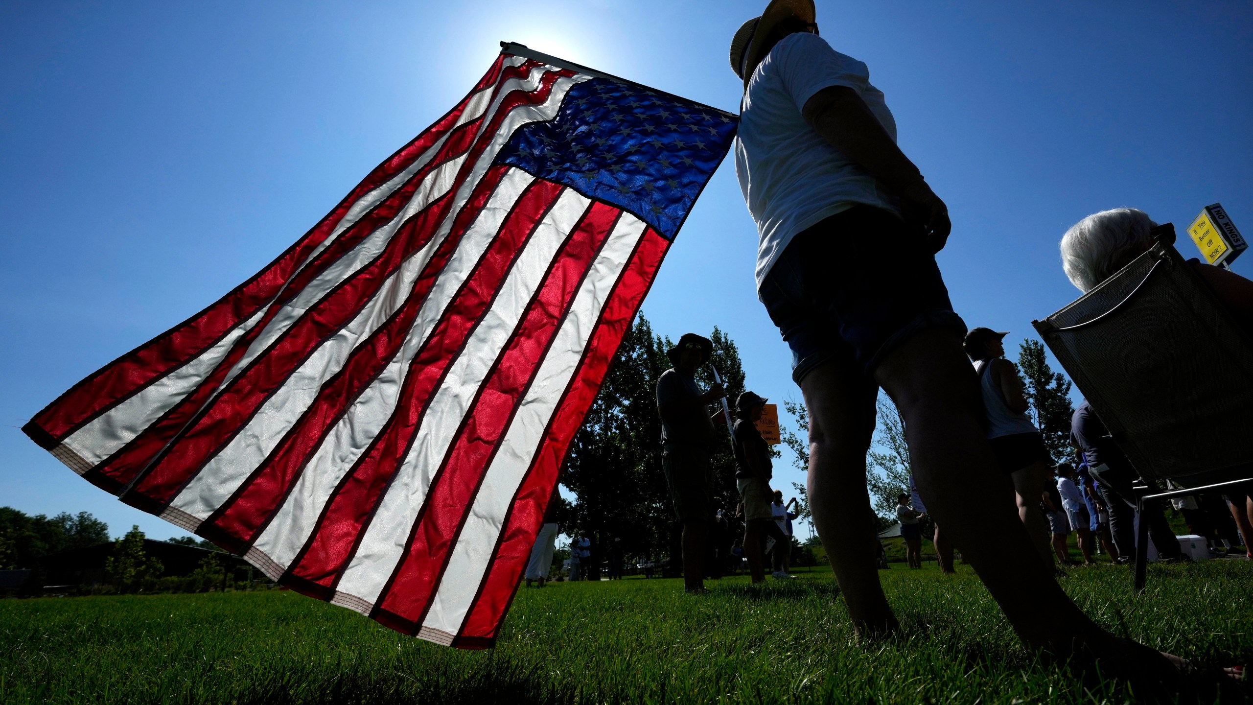 Theresa Peiffer, of Polk City, Iowa, listens to a speaker during an Iowa Democratic Party rally, Thursday, July 3, 2025, in Windsor Heights, Iowa. (AP Photo/Charlie Neibergall)