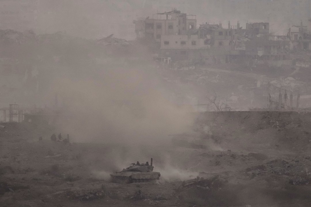 An Israeli army tank advances in the Gaza Strip, as seen from southern Israel on Thursday, July 3, 2025. (AP Photo/Leo Correa)