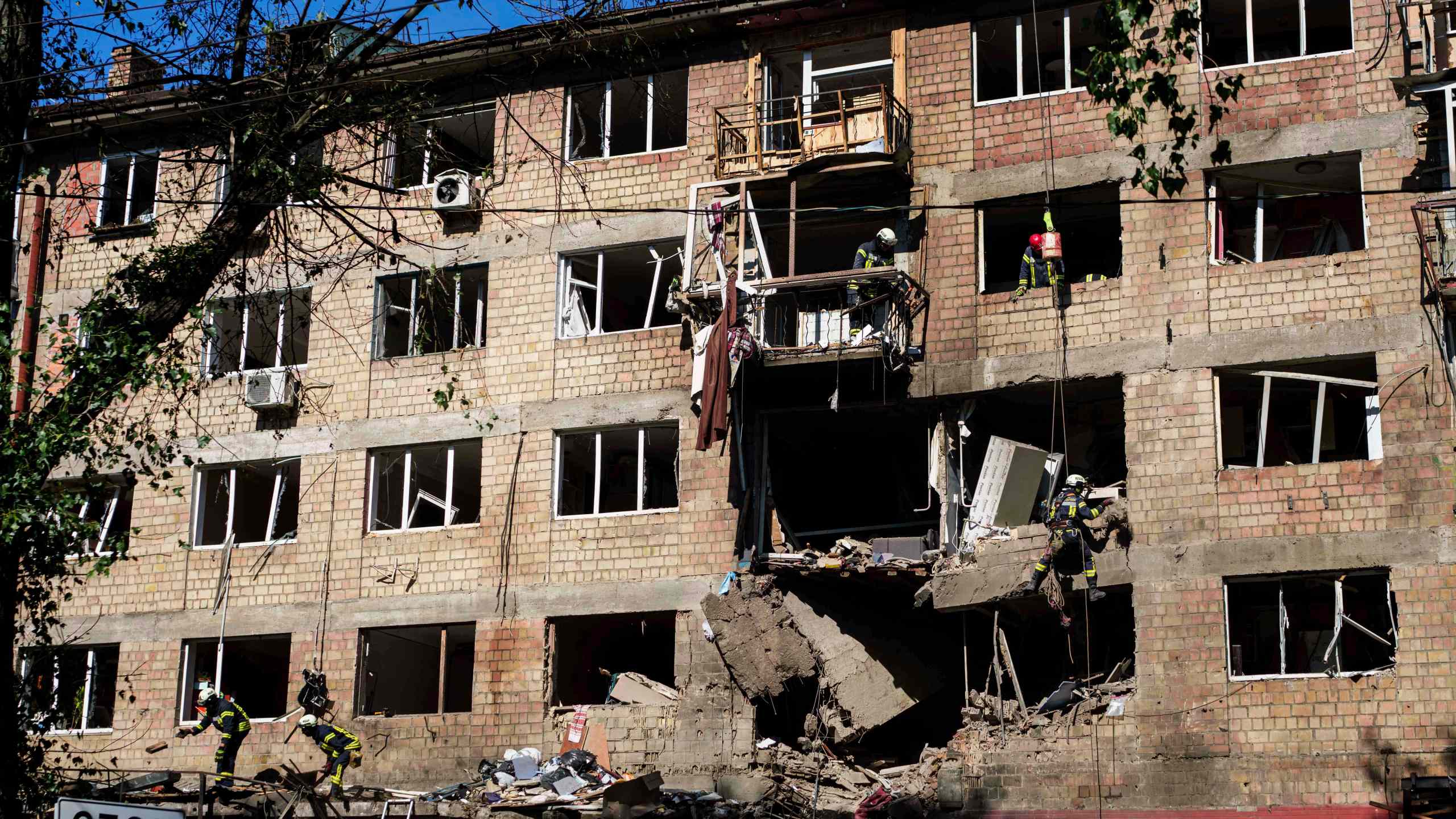 Rescue workers clear the rubble of a residential house damaged by a Russian strike in Kyiv, Ukraine, on Friday, July 4, 2025. (AP Photo/Evgeniy Maloletka)