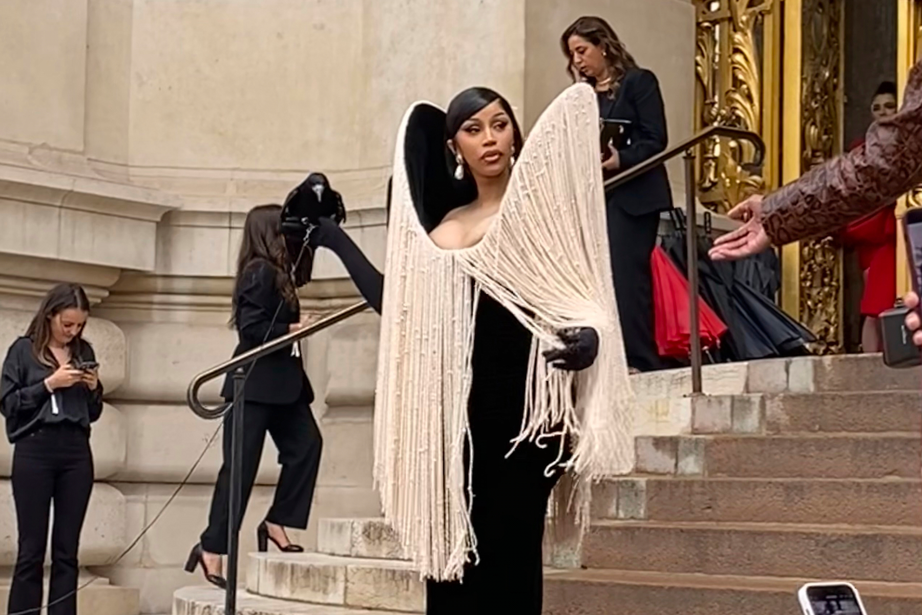 Cardi B holds a crow at Schiaparelli's Fall-Winter 2025/26 Haute Couture show in Paris, Monday, July 7, 2025. (AP Photo/Thomas Adamson)