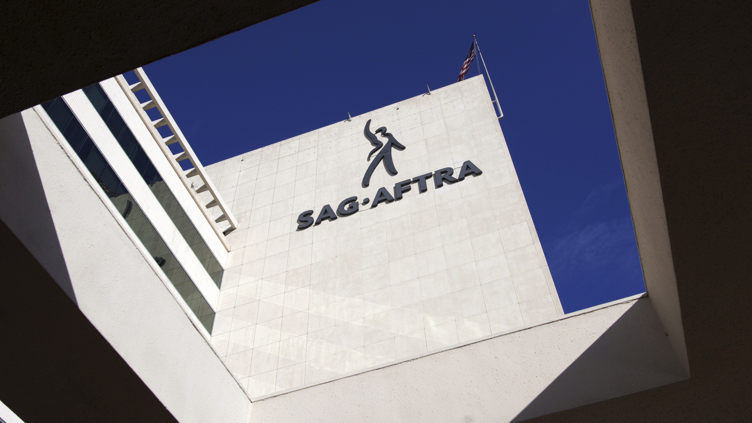 FILE - SAG-AFTRA signage is seen on the side of the headquarters in Los Angeles on Friday, Nov. 10, 2023. (AP Photo/Richard Vogel,File)