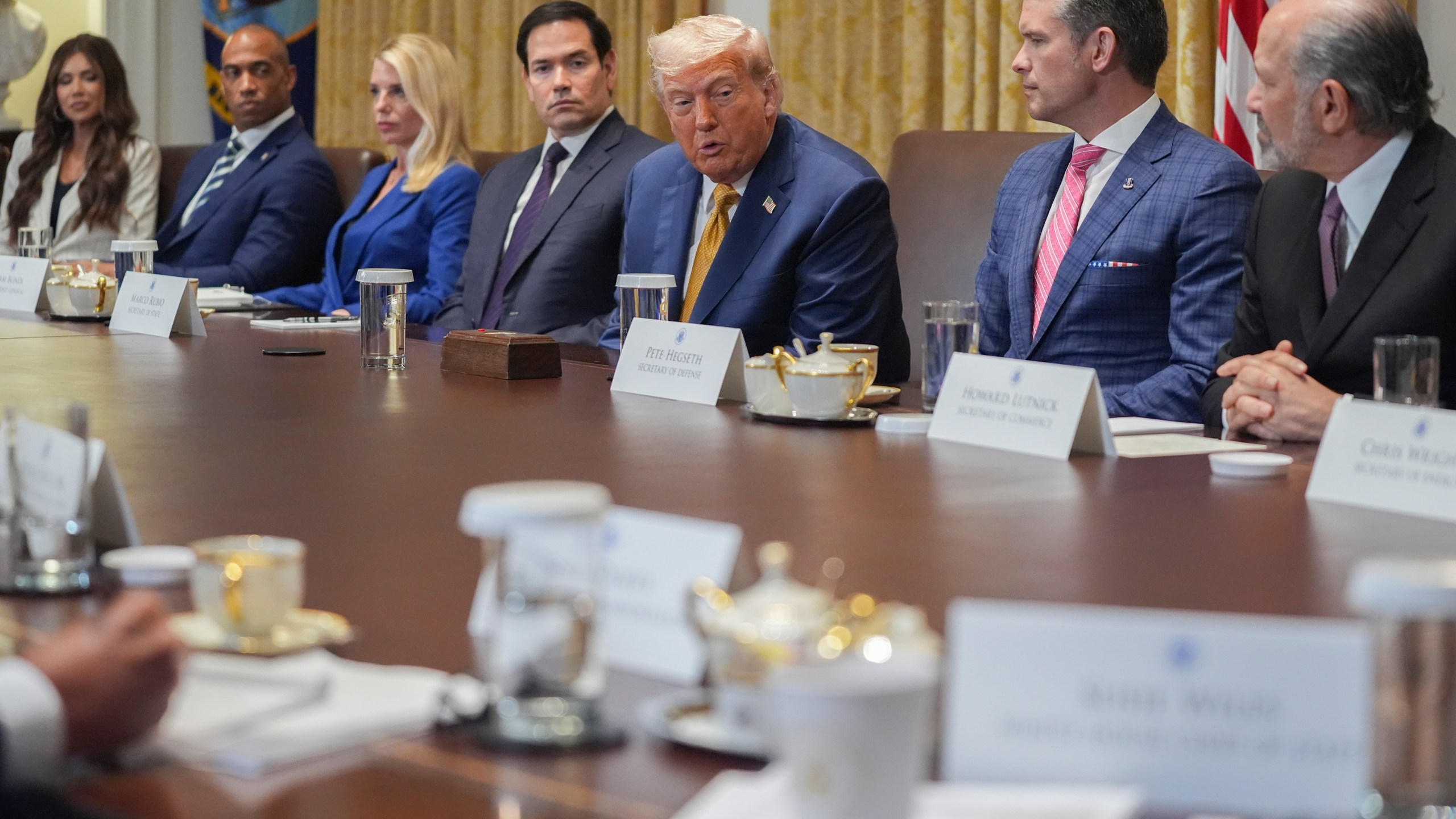 President Donald Trump, center, speaking during a cabinet meeting with from l-r., Homeland Security Secretary Kristi Noem, Secretary of Housing, Eric Scott Turner, Attorney General Pam Bondi, Secretary of State Marco Rubio, Secretary of Defense Pete Hegseth, and Secretary of Energy Chris Wright at the White House, Tuesday, July 8, 2025, in Washington. (AP Photo/Evan Vucci)