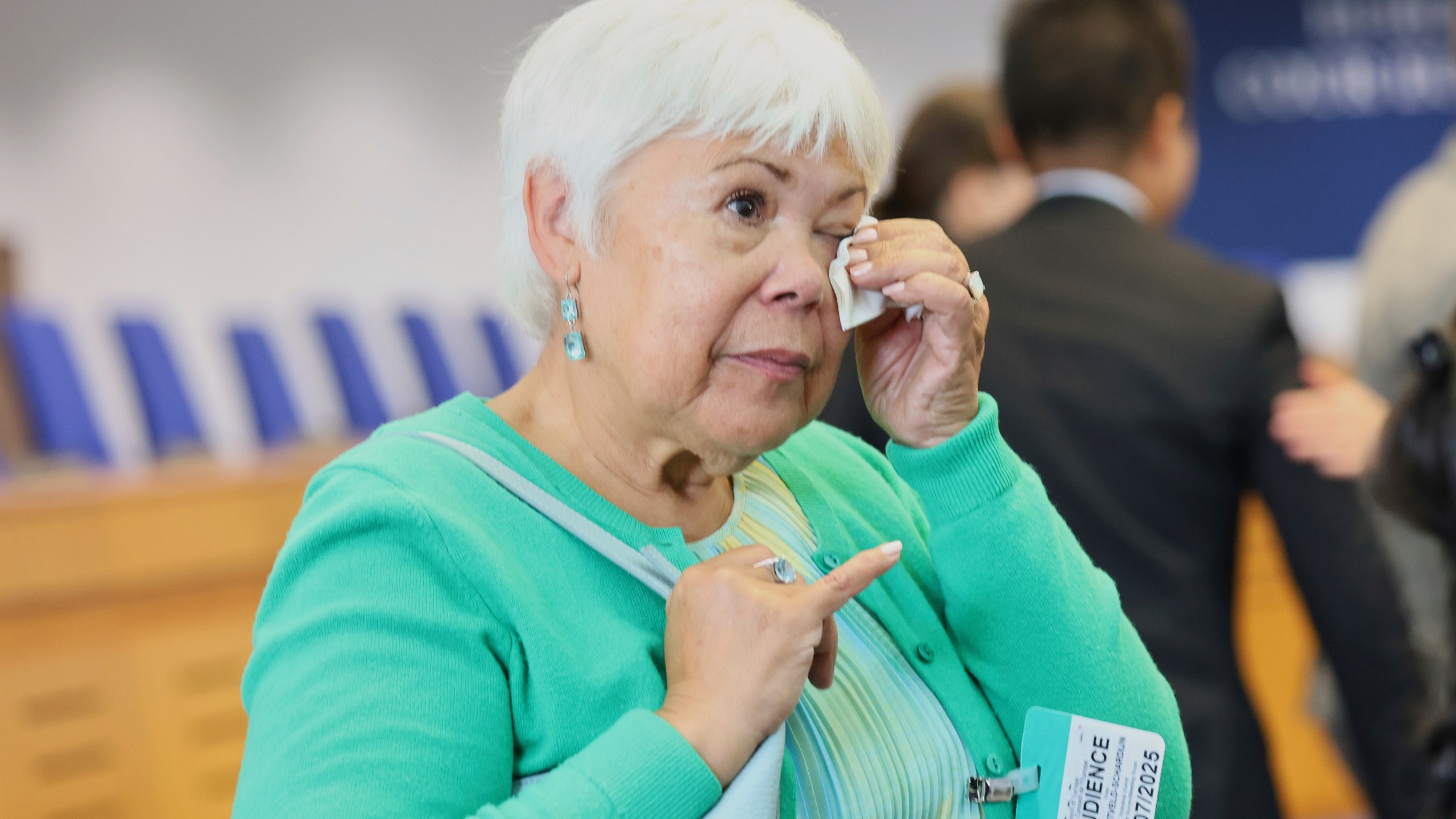Netherlands' Grace van Zijtveld-Schardijn reacts after the European Court of Human Rights issued its judgment on Russian violations in Ukraine since 2014, including the downing of Malaysia Airlines flight MH17, Wednesday, July 9, 2025 in Strasbourg, eastern France. (AP Photo/Antonin Utz)