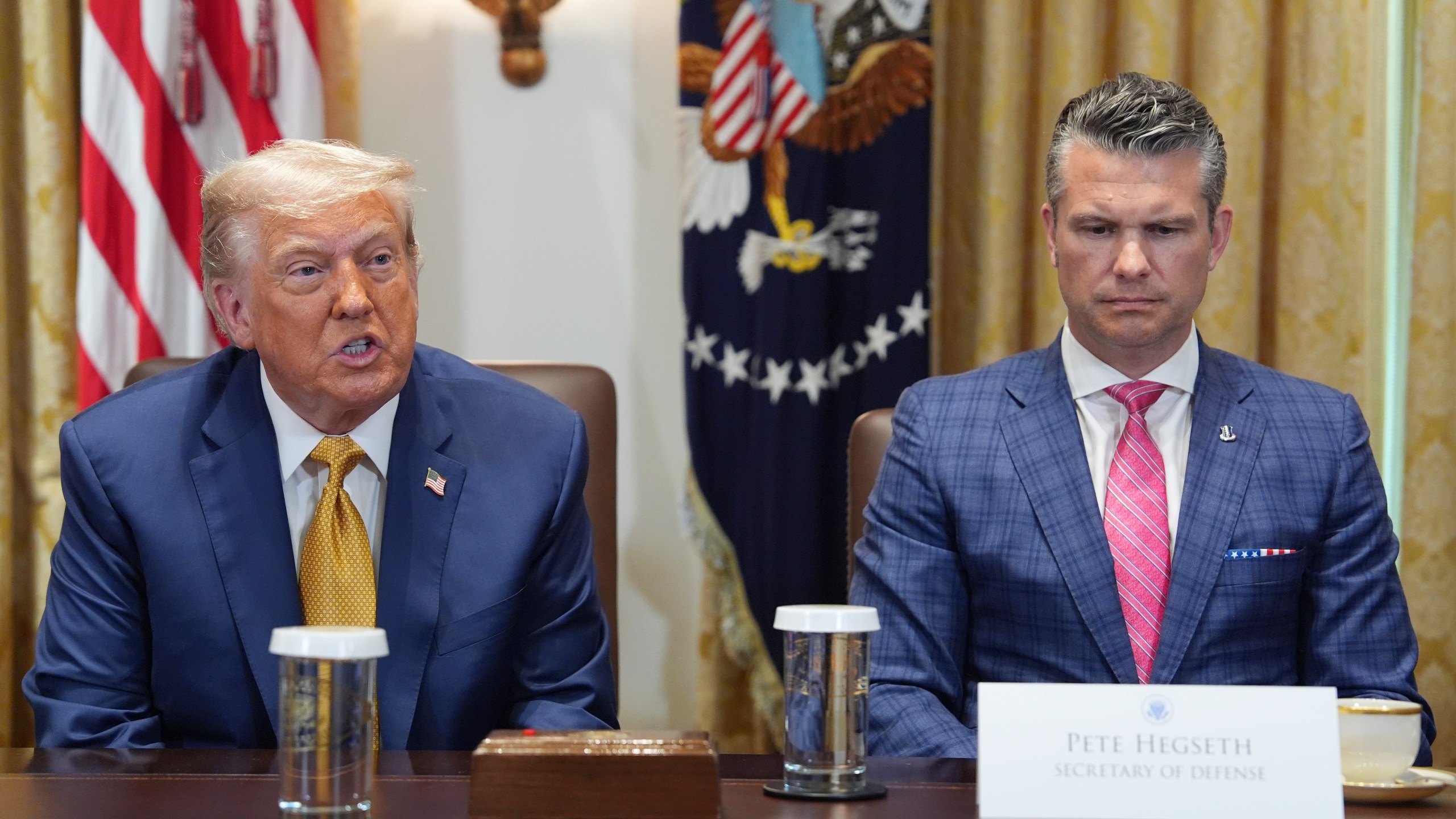 President Donald Trump, left, with Defense Secretary Pete Hegseth, right, during a cabinet meeting at the White House, Tuesday, July 8, 2025, in Washington. (AP Photo/Evan Vucci)