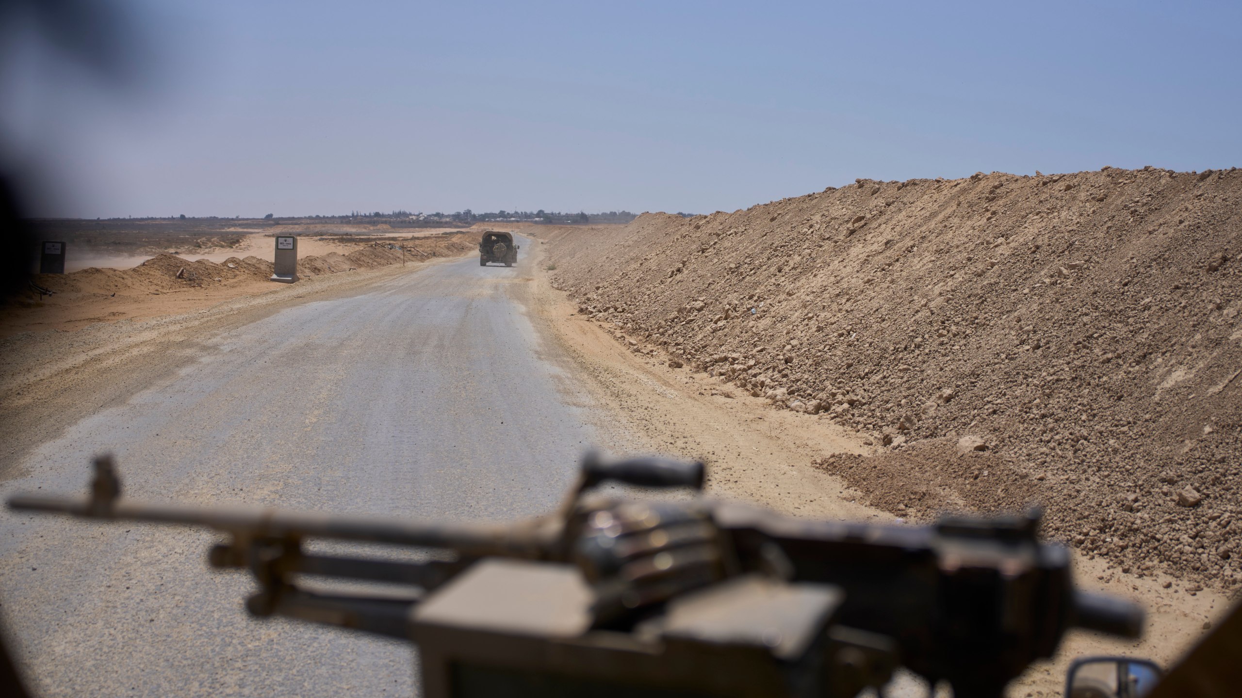 Israeli army vehicles transport a group of soldiers and journalists along the Morag corridor in southern Gaza on June 8, 2025. The Israeli military invited reporters for a tour in the European Hospital in Khan Younis. (AP Photo/Ohad Zwigenberg)