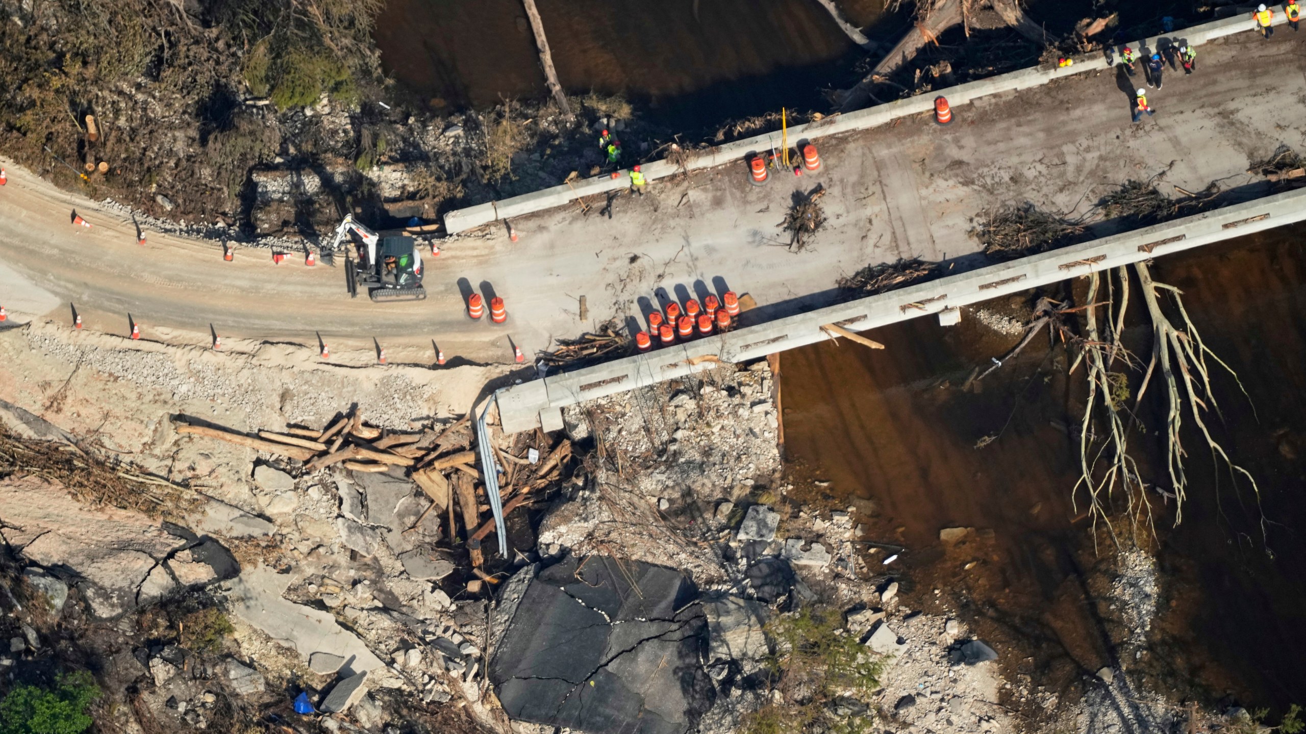 This aerial photo shows damage from flash floods along the Guadalupe River in Ingram, Texas, Thursday, July 10, 2025. (AP Photo/Gerald Herbert)