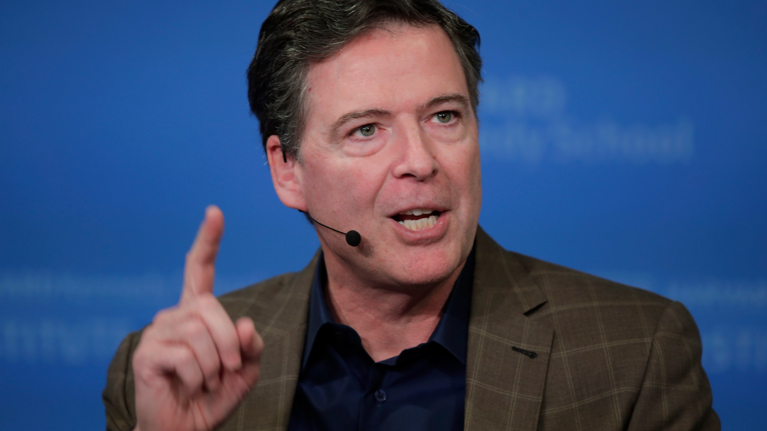 FILE - Former Director of the Federal Bureau of Investigation James Comey speaks at Harvard University's Institute of Politics' JFK Jr. Forum in Cambridge, Mass., Feb. 24, 2020. (AP Photo/Charles Krupa, File)