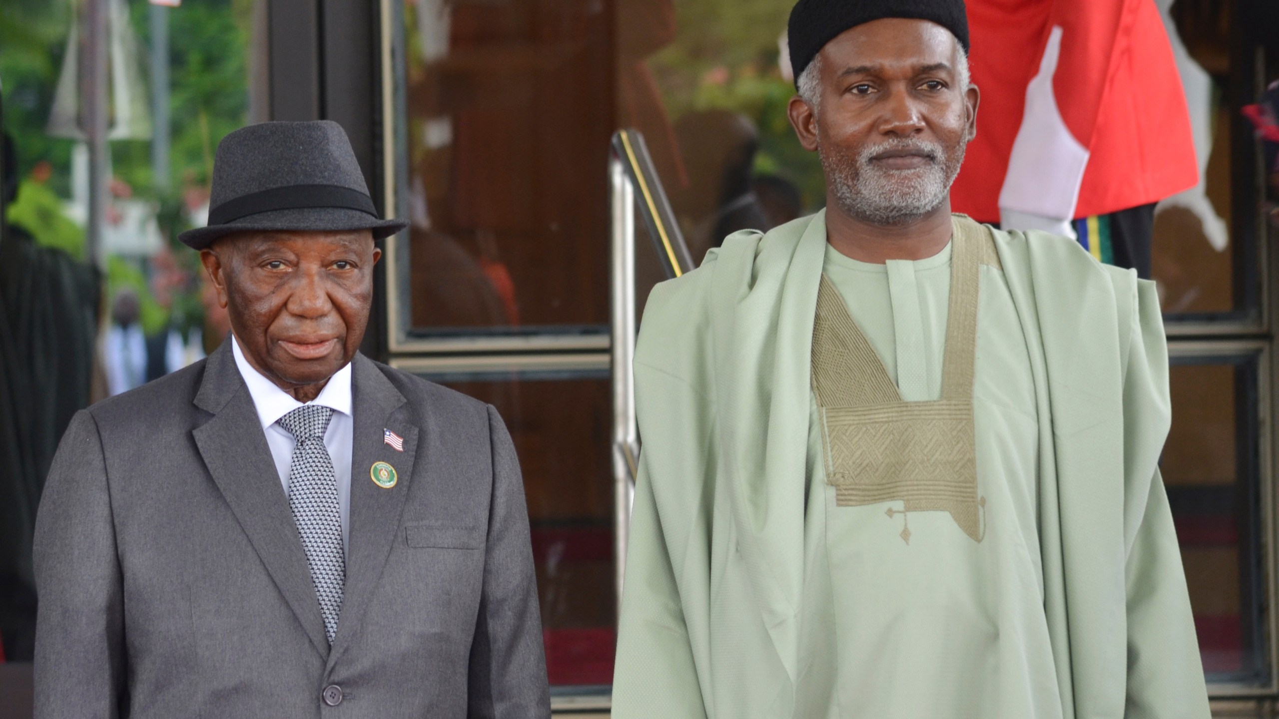 FILE - Liberia's President, Joseph Boakai, left, and Nigeria Minister of Foreign Affairs, Yusuf Tuggar, right, pose for a photo, prior to the start of the ECOWAS meeting, in Abuja, Nigeria, July 7, 2024. (AP Photo/Olamikan Gbemiga, File)