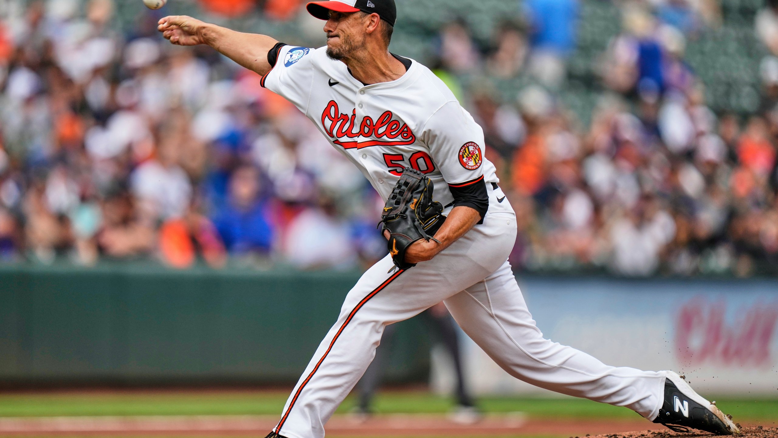 Baltimore Orioles starting pitcher Charlie Morton (50) delivers during the second inning in the first baseball game of a doubleheader against the New York Mets, Thursday, July 10, 2025, in Baltimore. (AP Photo/Stephanie Scarbrough)