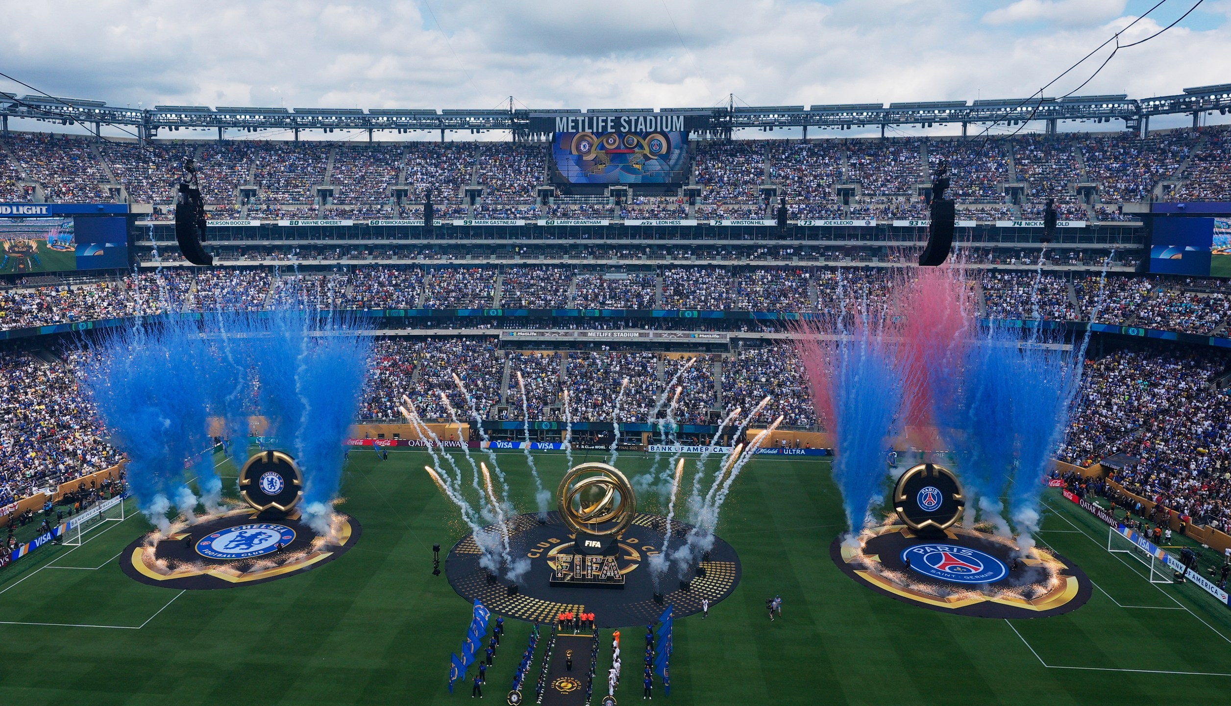 Players stand line before starting the Club World Cup final soccer match between Chelsea and PSG in East Rutherford, N.J., Sunday, July 13, 2025. (AP Photo/Pamela Smith)