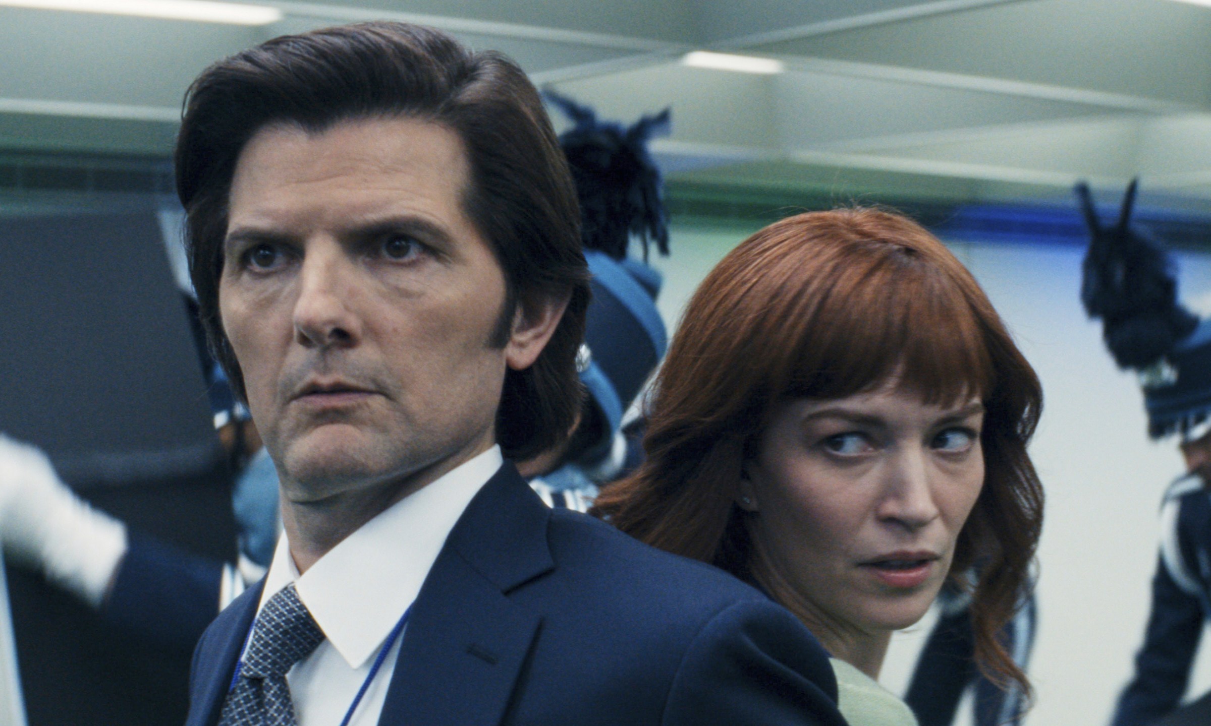 This image released by Apple TV+. shows Adam Scott, left, and Britt Lower in a scene from "Severance." (Apple TV+ via AP)