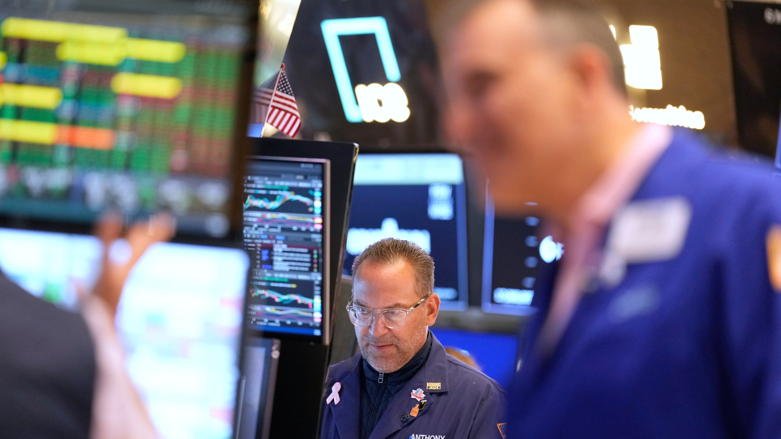 Anthony Matesic works on the floor at the New York Stock Exchange in New York, Wednesday, July 16, 2025. (AP Photo/Seth Wenig)