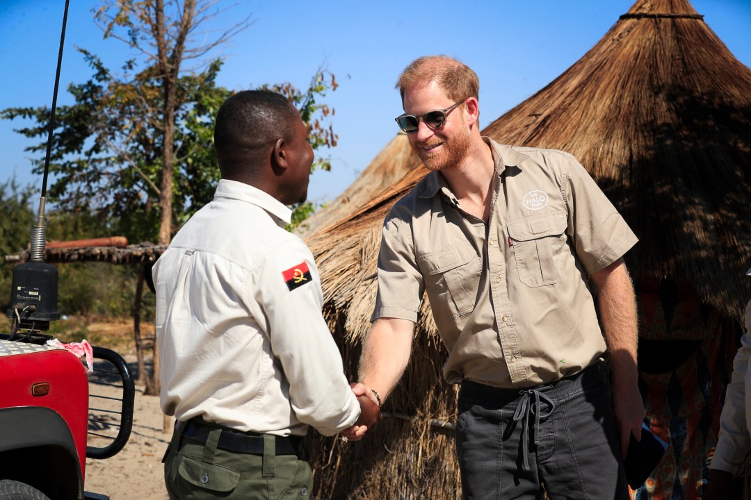Britain's Prince Harry is greeted as he visits the work of landmine clearance charity of the Halo Trust, in Cuito Cuanavale, Cuando province, southern Angola, Wednesday, July 16, 2025. (Ampe Pedro/The Halo Trust via AP)