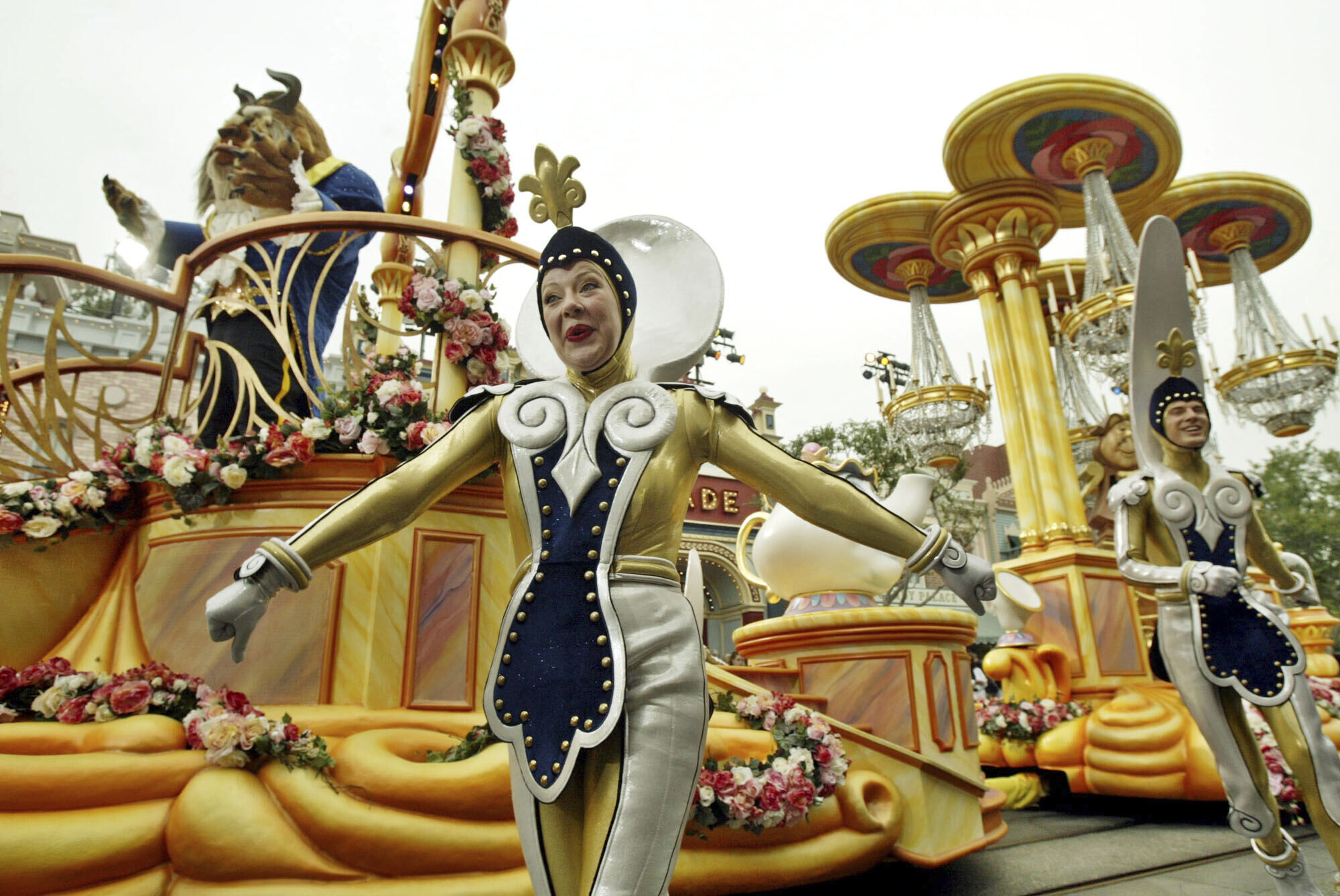 FILE - The "Beauty and the Beast" float, along with supporting characters, entertains visitors to Disneyland during "Walt Disney's Parade of Dreams" in Anaheim, Calif., May 4, 2005. (AP Photo/Ric Francis, File)