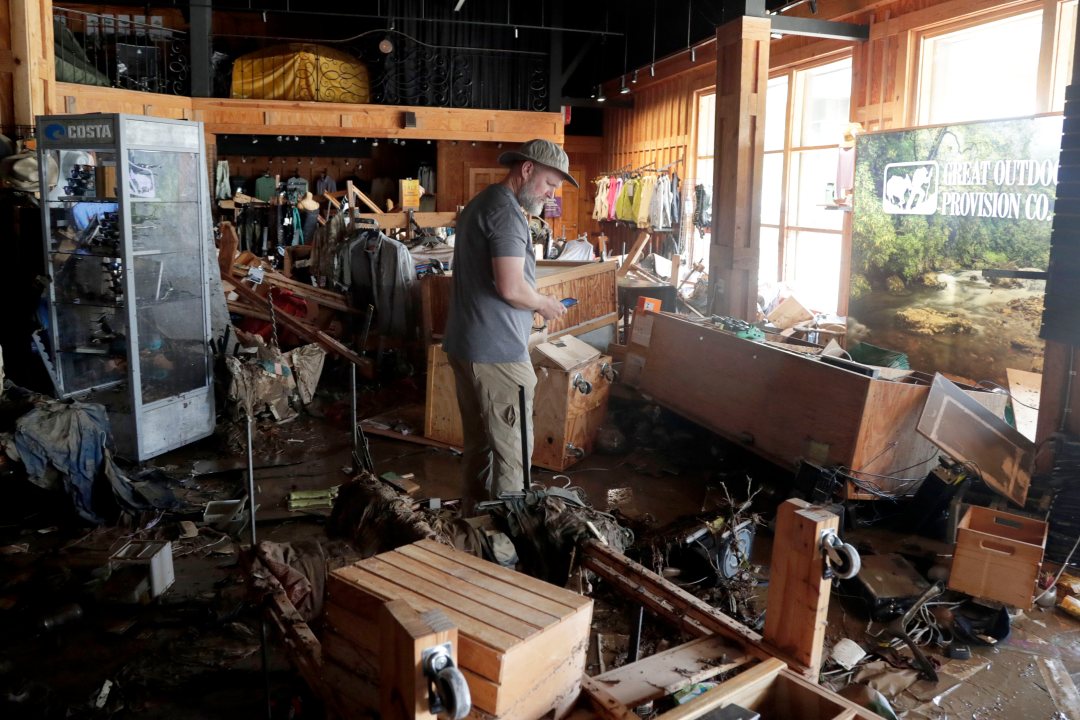 An employee surveys the damage at the Great Outdoor Provision Co.