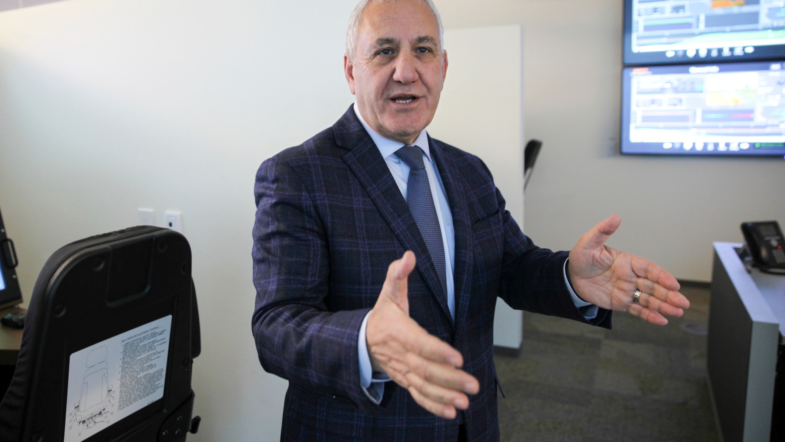 FILE - Union Pacific CEO Jim Vena talks in front of a locomotive simulator used to train engineers at the company's headquarters in Omaha, Neb., Dec. 15, 2023. (AP Photo/Josh Funk, File)