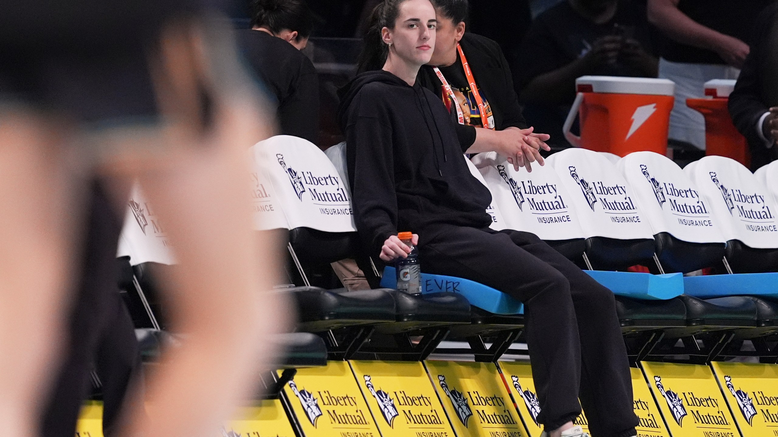 FILE - Indiana Fever's Caitlin Clark watches as players warm up before a WNBA basketball game between the New York Liberty and the Fever Wednesday, July 16, 2025, in New York. (AP Photo/Frank Franklin II, File)