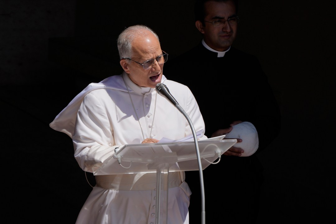 Pope Leo XIV blesses the faithful gathered in the square in front of the Apostolic Palace for the noon Angelus prayer in Castel Gandolfo, Italy, Sunday, July 20, 2025. (AP Photo/Gregorio Borgia)