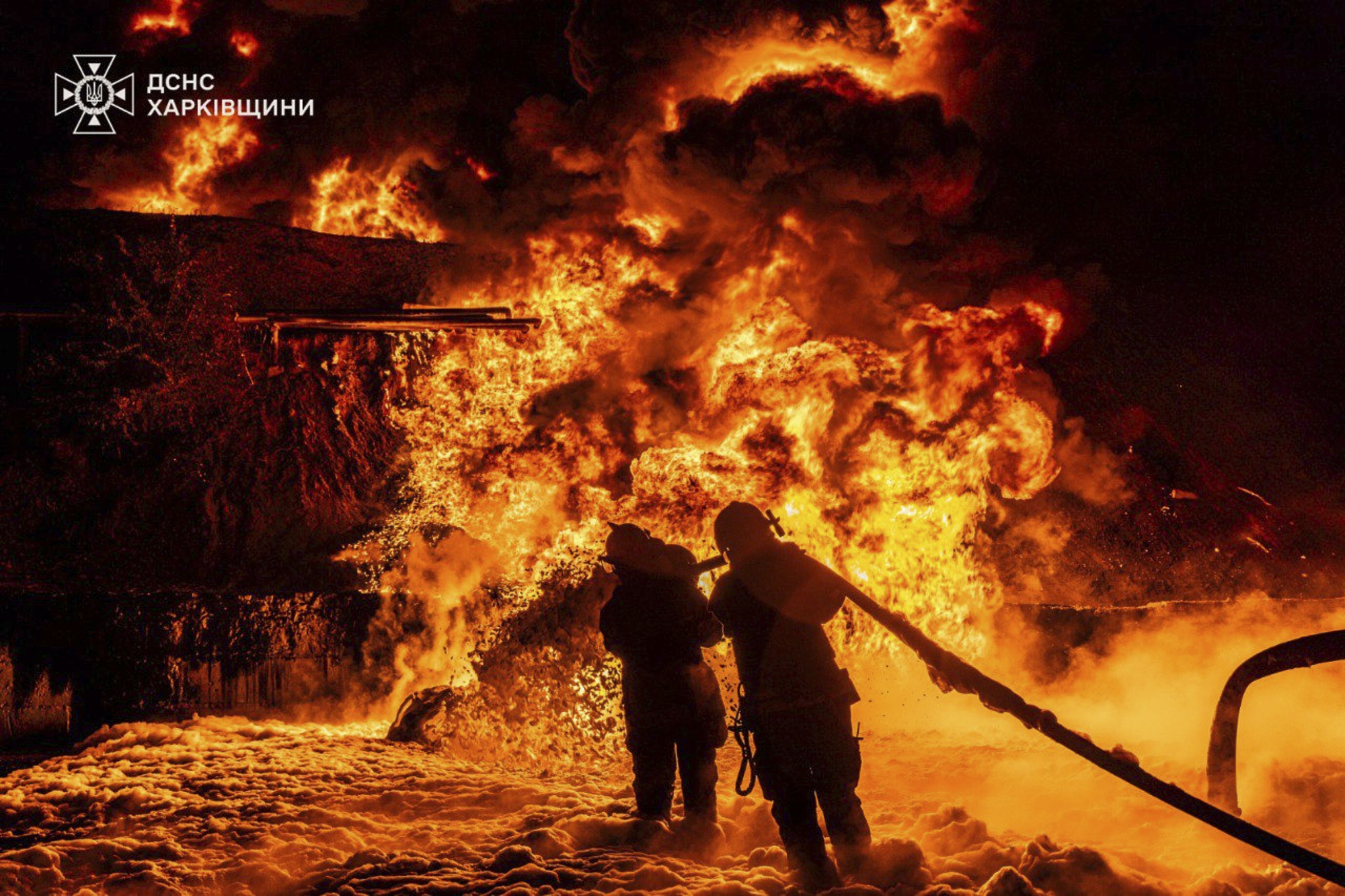 FILE - In this photo provided by the Ukrainian Emergency Service, emergency services personnel work to extinguish a fire following a Russian attack in Kharkiv region, Ukraine, July 5, 2025. (Ukrainian Emergency Service via AP, file)