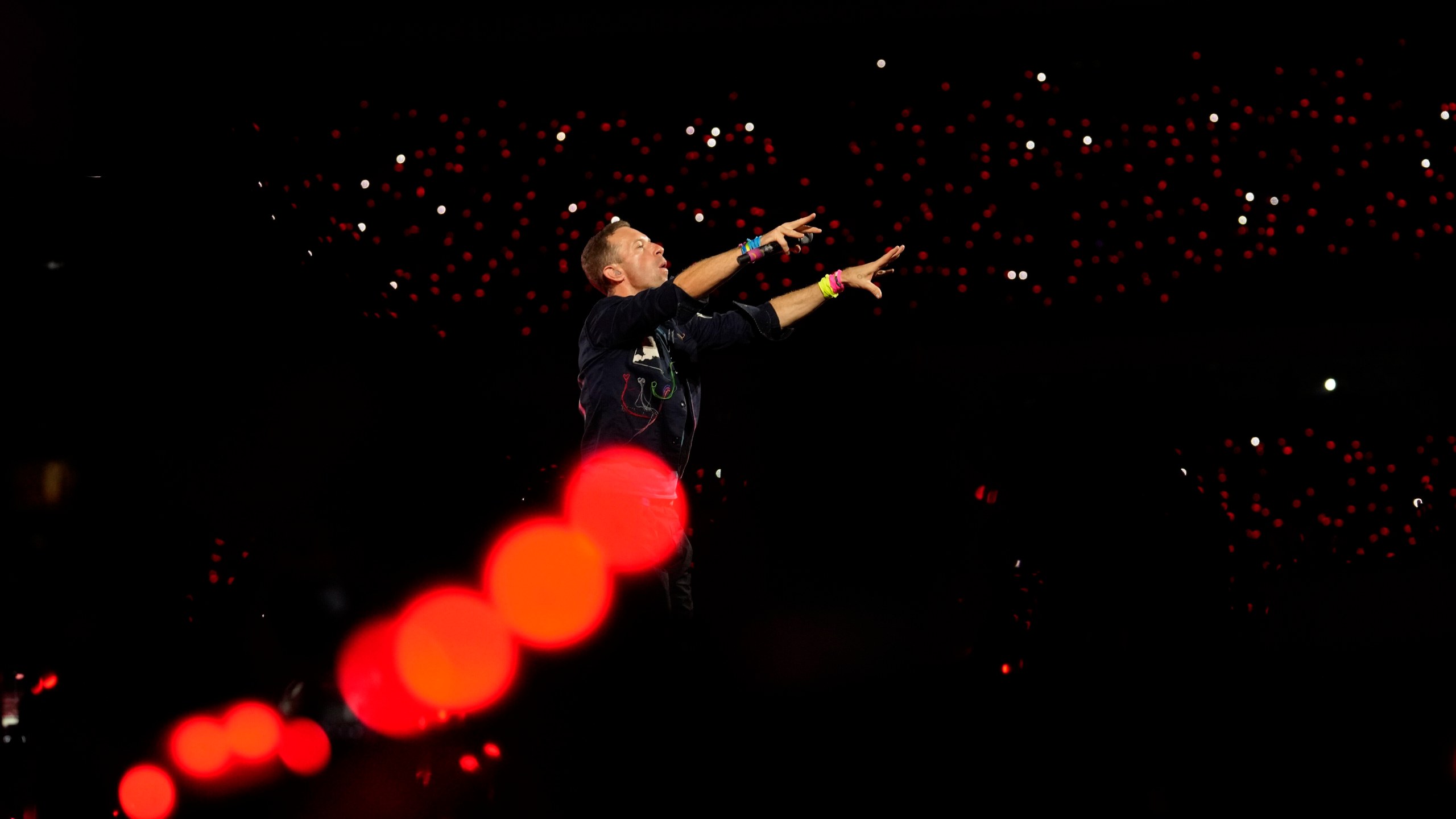 FILE - Chris Martin of Coldplay performs during the band's Music Of The Spheres World Tour at D. Y. Patil Sports Stadium in Navi Mumbai, Saturday, Jan. 18, 2025. (AP Photo/Rajanish Kakade, File)