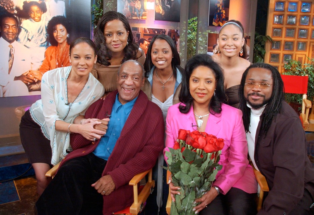 FILE - Members of Bill Cosby's television family, the Huxtables, Sabrina Le Beauf, from left, Tempest Bledsoe, Cosby, Keshia Knight Pulliam, Phylicia Rashad, Raven Symone and Malcolm-Jamal Warner, gather in NBC's Today show studio for an interview with co-host Katie Couric, Thursday, May 2, 2002, in New York. (AP Photo/Richard Drew, File)