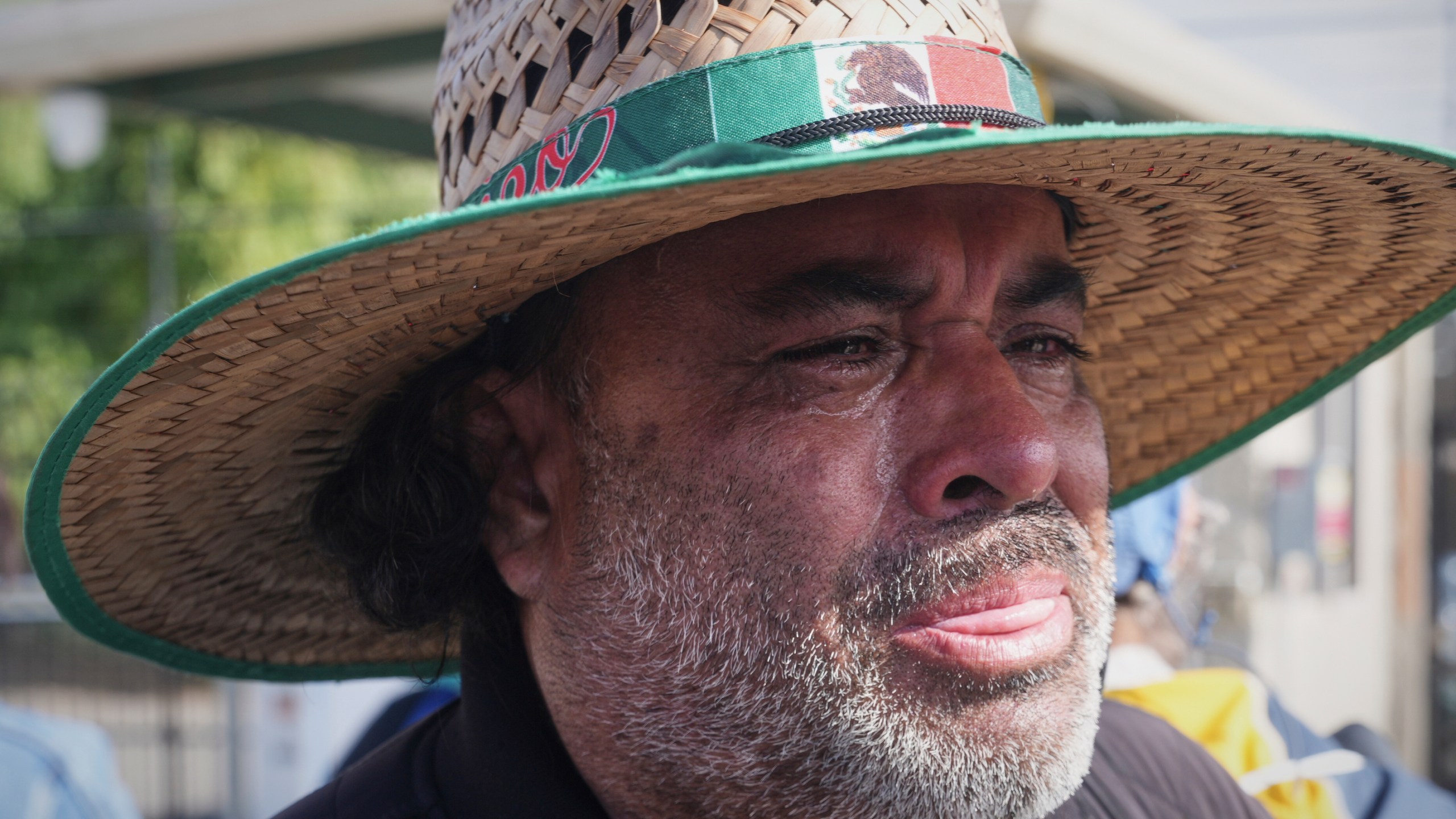 FILE - Juan Duran cries outside of Glass House Farms, where a relative was injured during a previous day immigration raid, on Friday, July 11, 2025, in Camarillo, Calif. (AP Photo/Damian Dovarganes, File)
