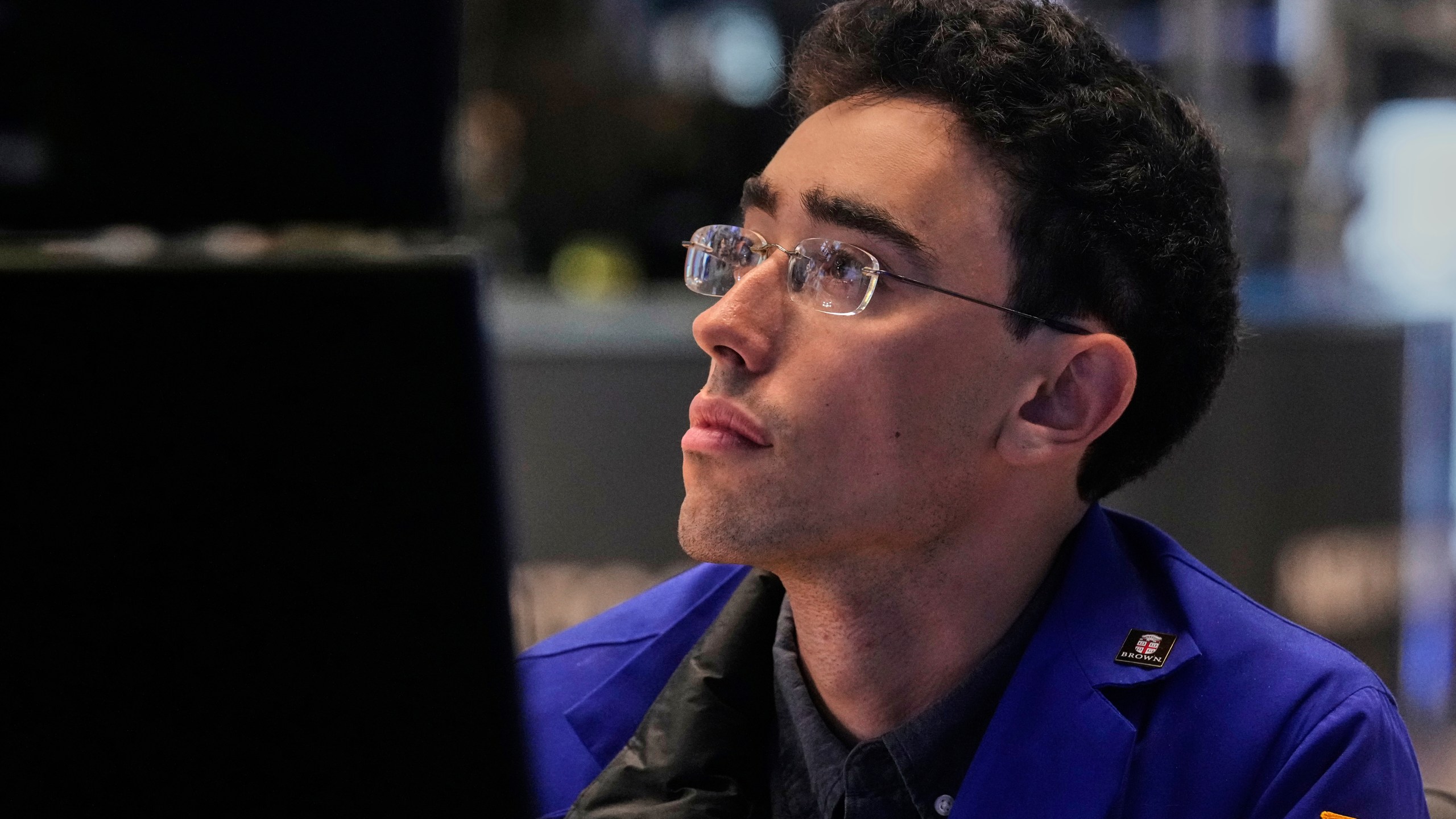Specialist Alex Weitzman works at his post on the floor of the New York Stock Exchange, Monday, July 21, 2025. (AP Photo/Richard Drew)