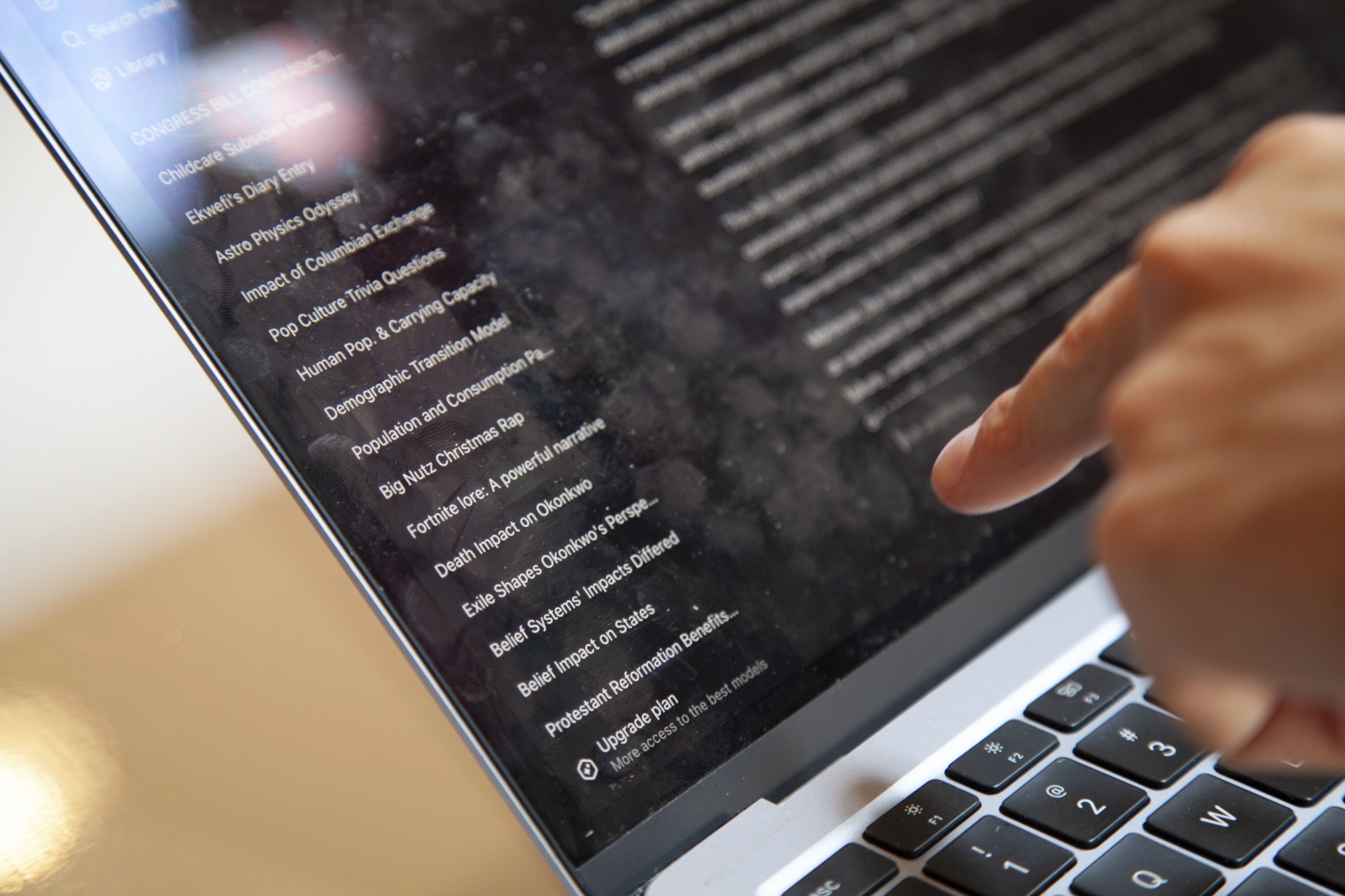 Bruce Perry, 17, shows his ChatGPT history at a coffee shop in Russellville, Ark., Tuesday, July 15, 2025. (AP Photo/Katie Adkins)