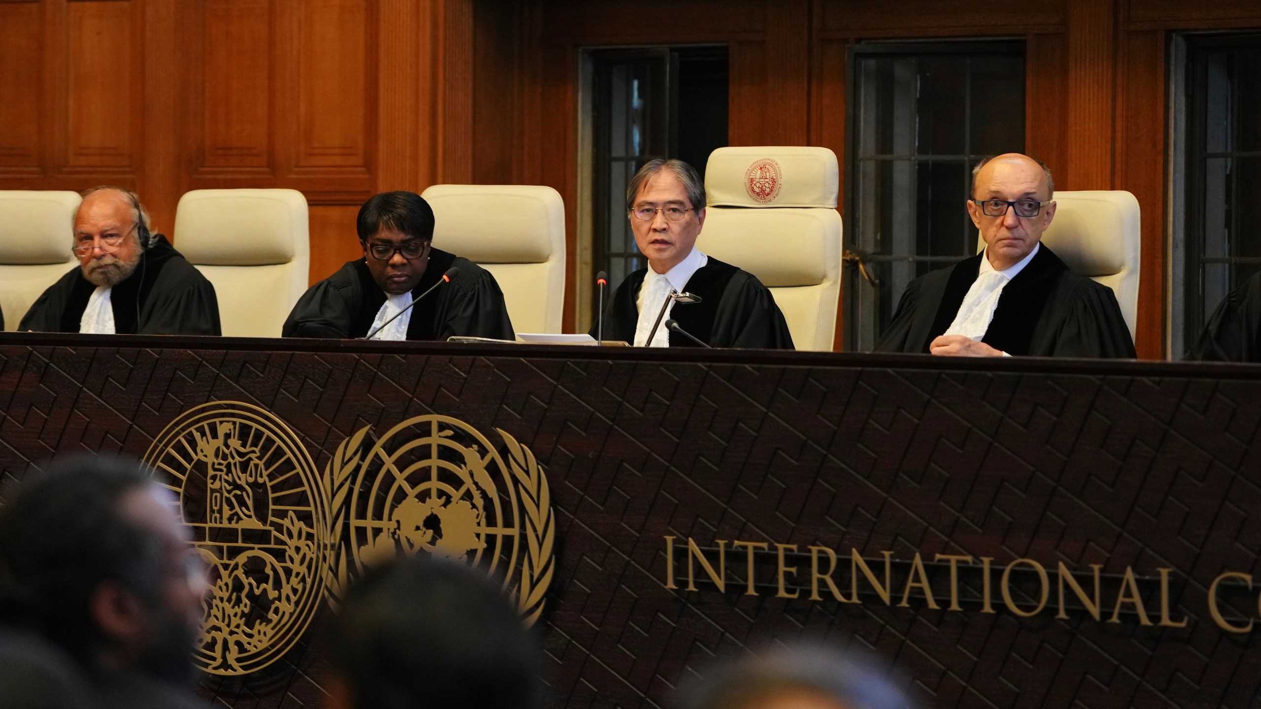 Presiding judge Yuji Iwasawa, second from right, speaks at a hearing to deliver an advisory opinion on what legal obligations nations have to address climate change and what consequences they may face if they don't, Wednesday, July 23, 2025, in The Hague, Netherlands. (AP Photo/Peter Dejong)