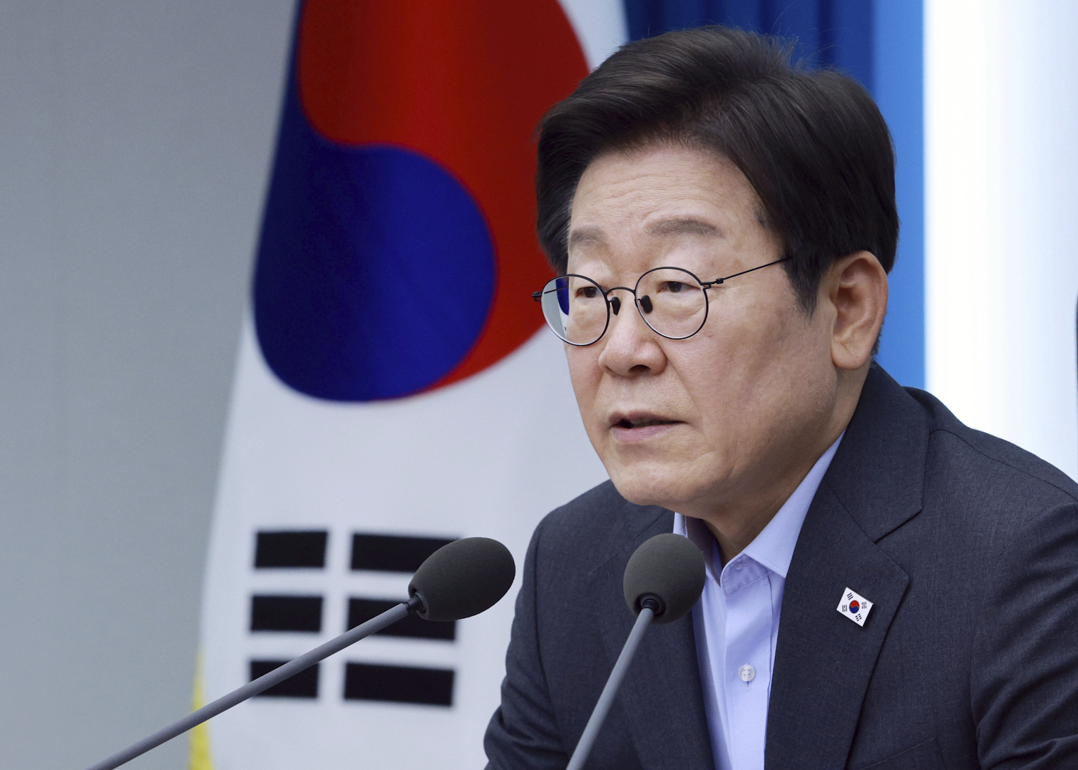 South Korean President Lee Jae Myung speaks at a podium