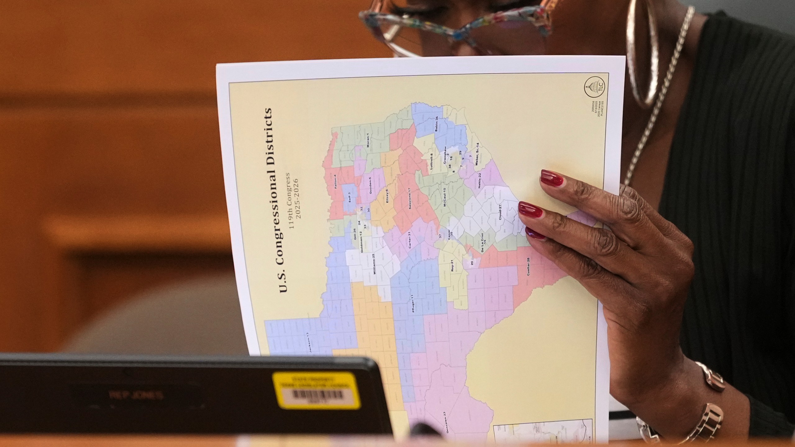 Texas state Rep. Jolanda "Jo" Jones looks through U.S. Congressional District maps during a redistricting hearing