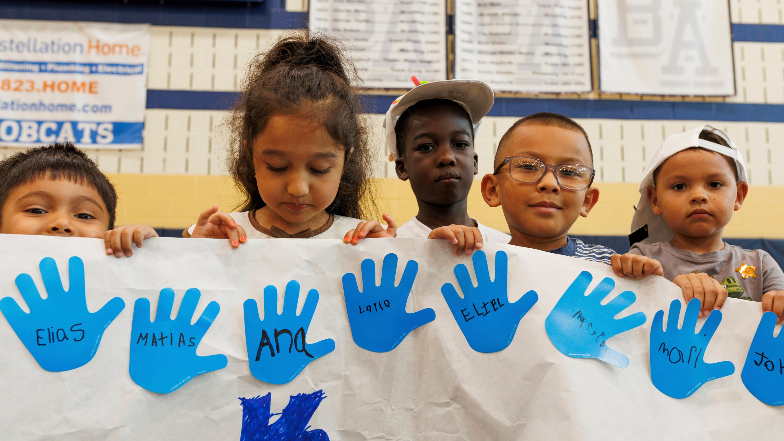 LASOS summer campers hold up an art project at Bel Air High School in Bel Air, Md., on Thursday, July 24, 2025. (AP Photo/KT Kanazawich)
